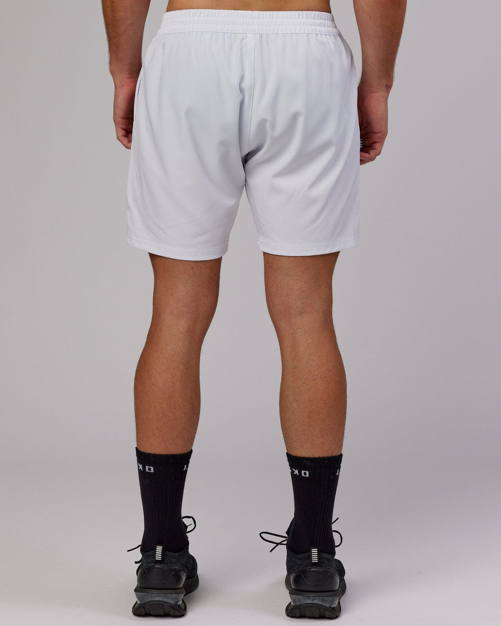 Model wearing Capsule 7" Performance Short - White