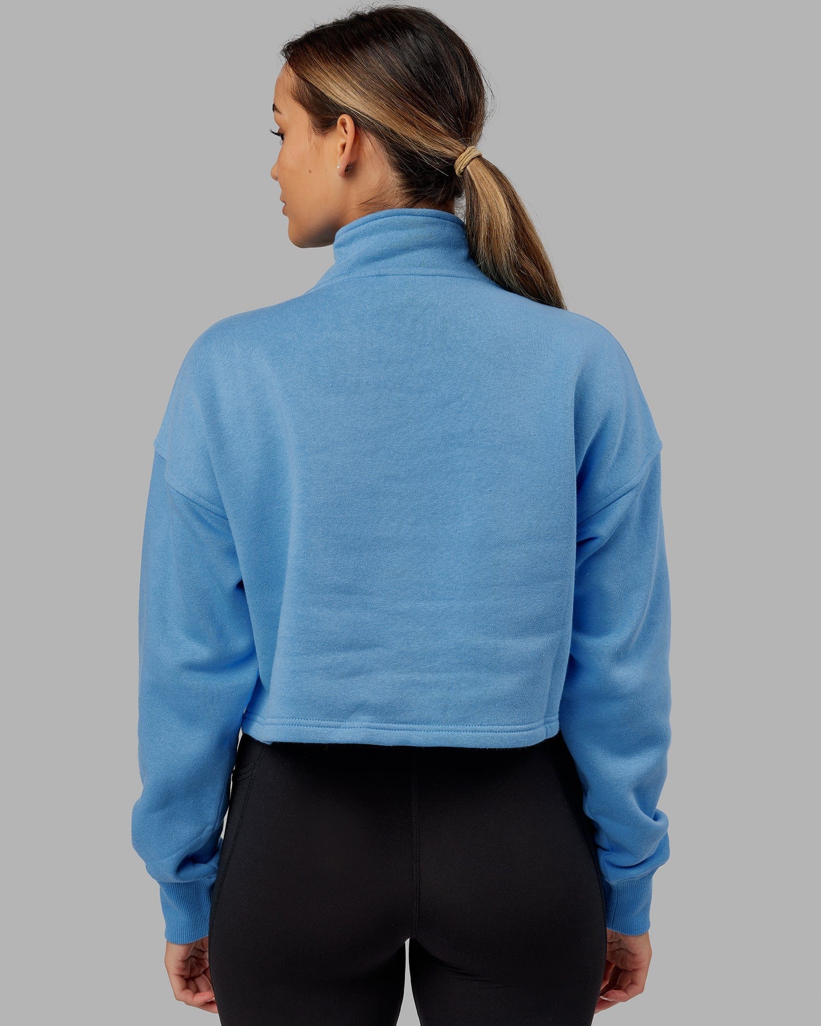 Model wearing Challenger 1/4 Zip Sweater - Azure Blue