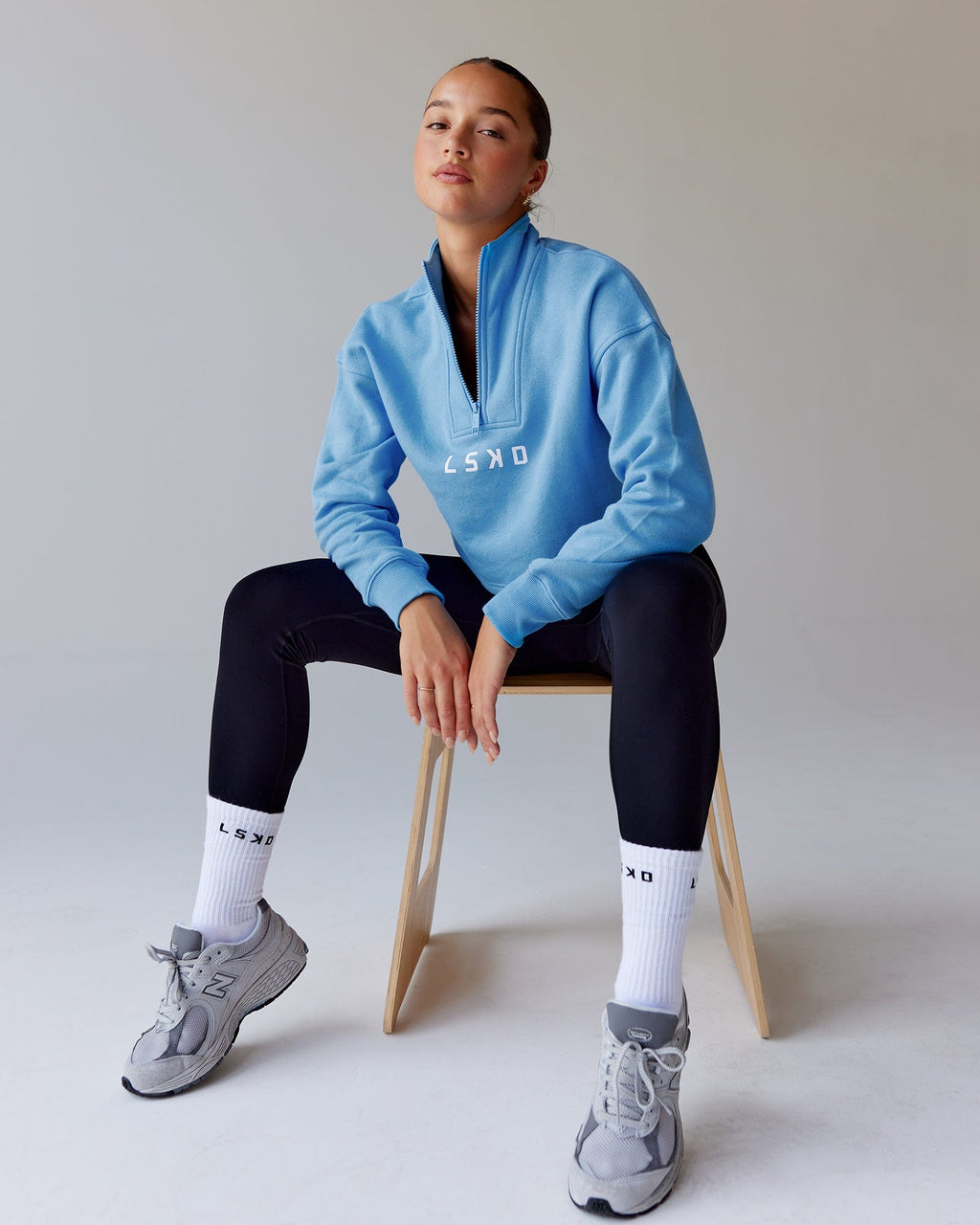 Model wearing Challenger 1/4 Zip Sweater - Azure Blue