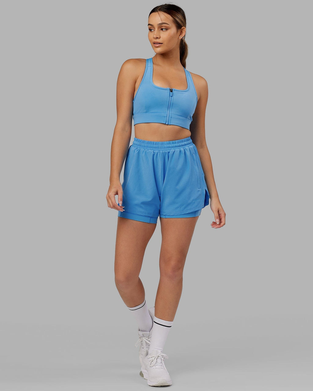 Model wearing Challenger Liner Run Short - Azure Blue
