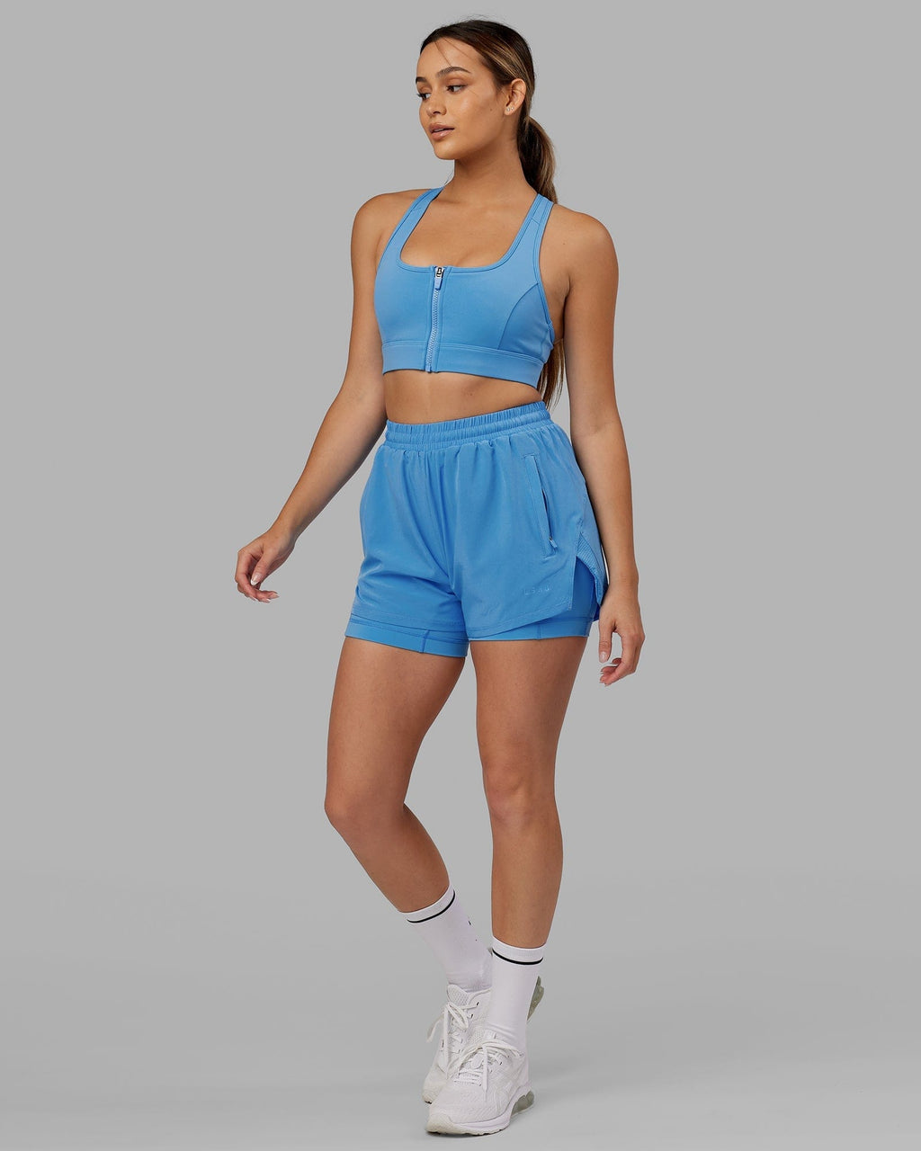 Model wearing Challenger Liner Run Short - Azure Blue