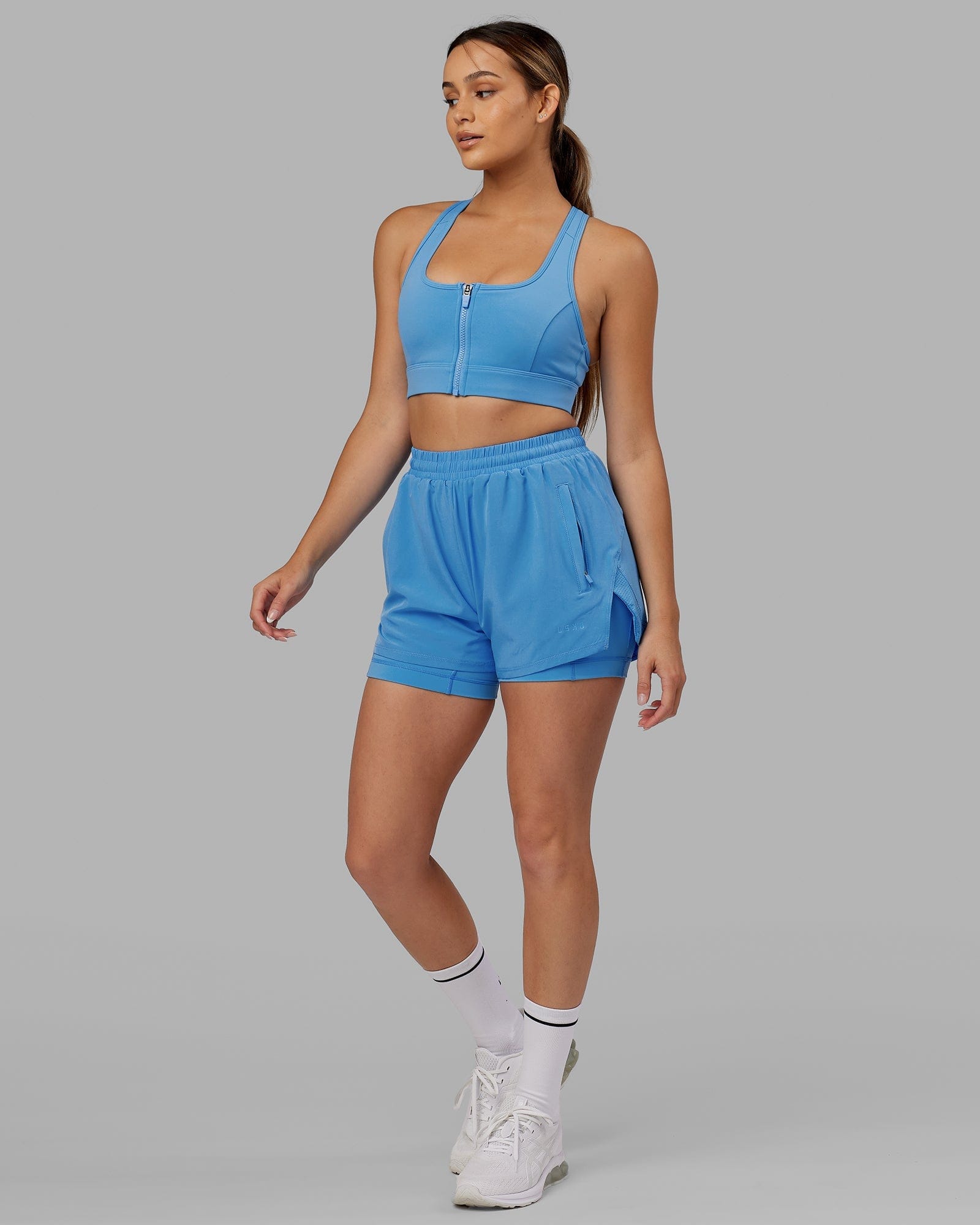 Model wearing Challenger Liner Run Short - Azure Blue