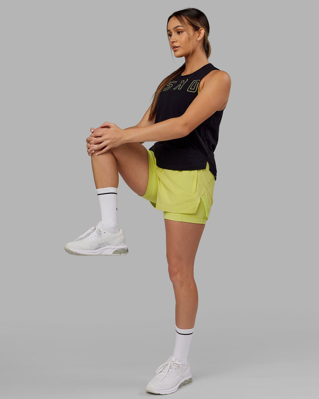 Model wearing Challenger Liner Run Short - Citrus Green