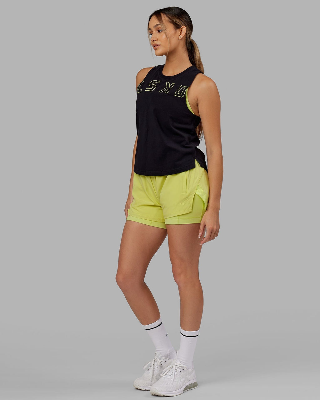 Model wearing Challenger Liner Run Short - Citrus Green
