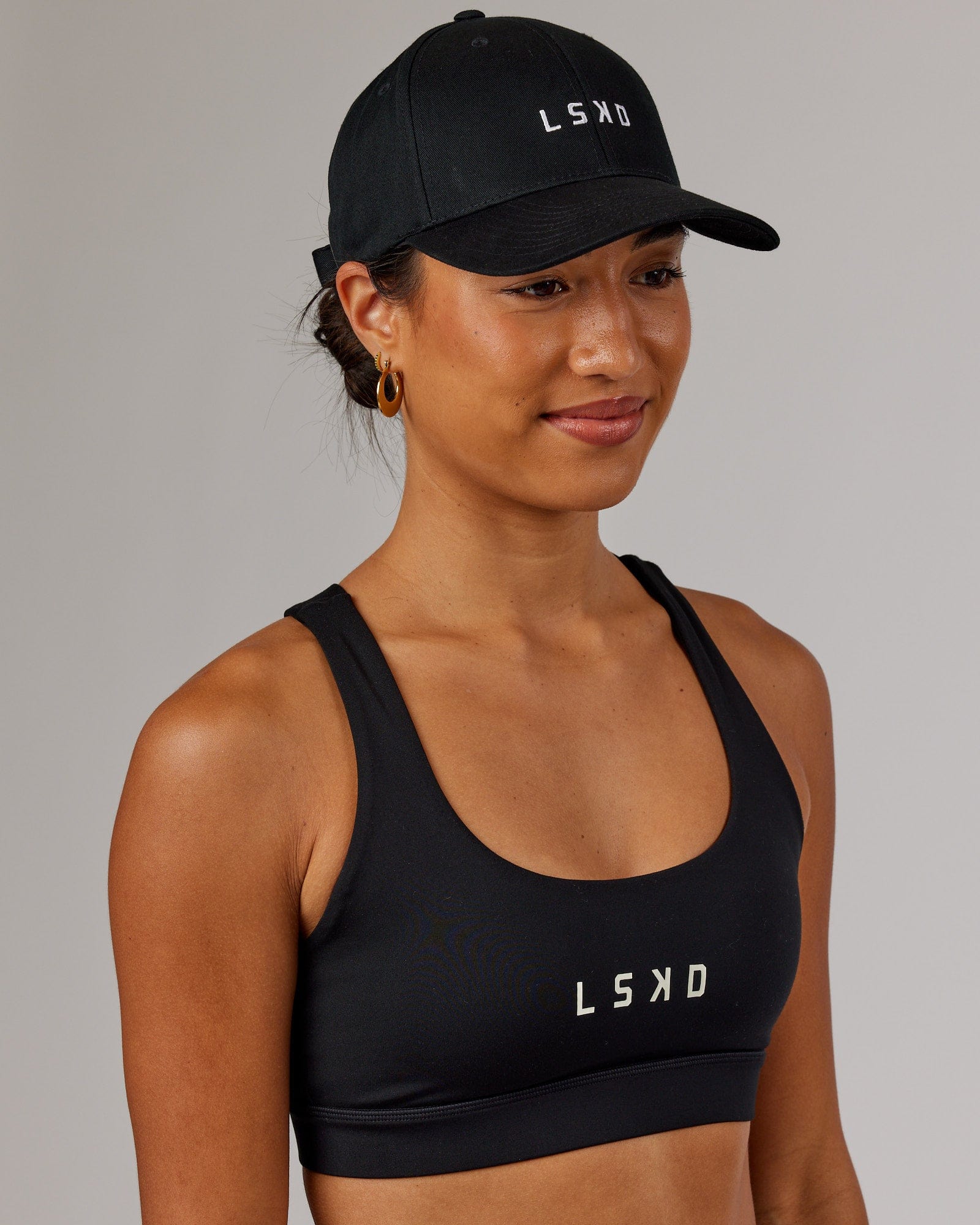 Model wearing Classic Strapback Cap - Black