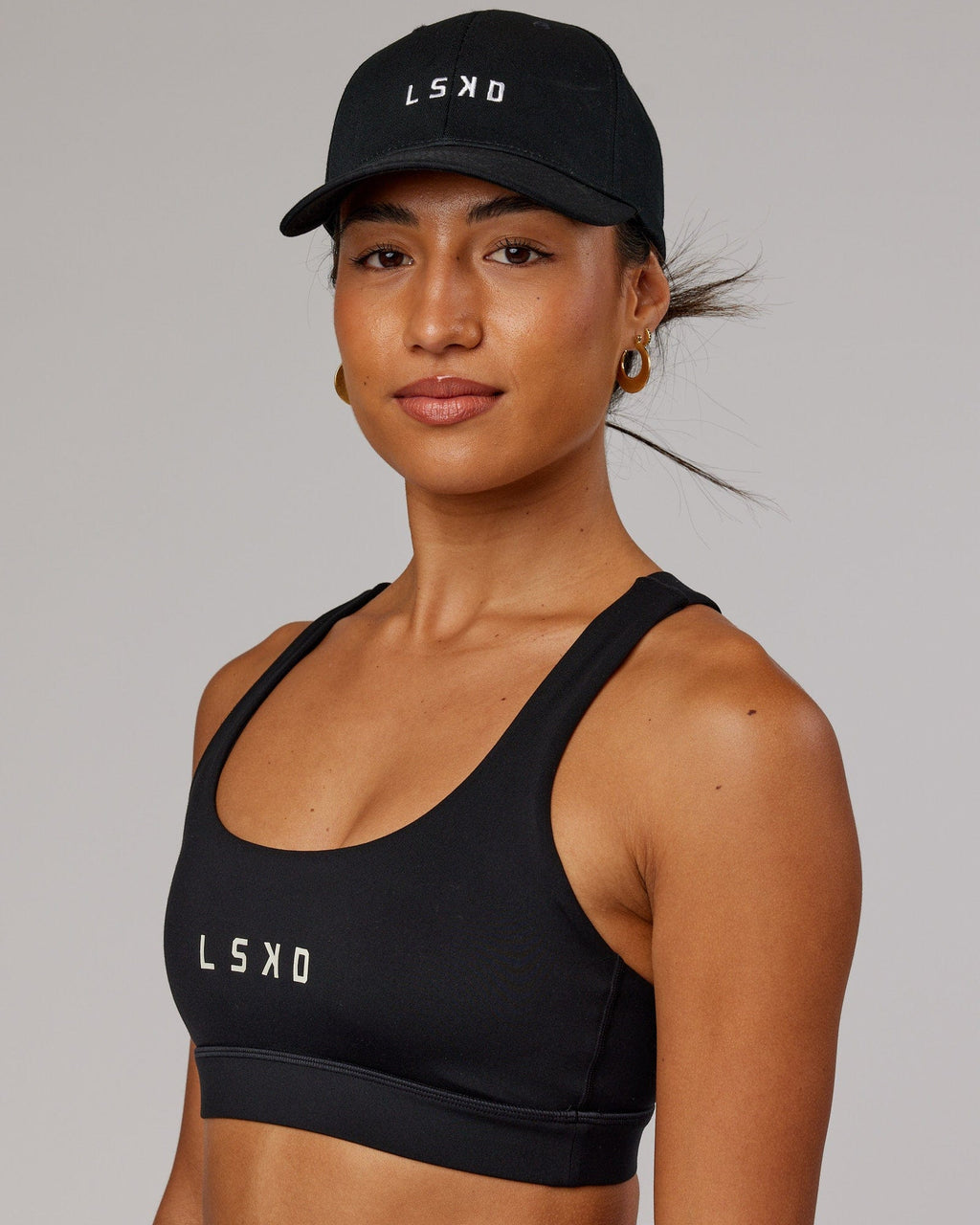 Model wearing Classic Strapback Cap - Black