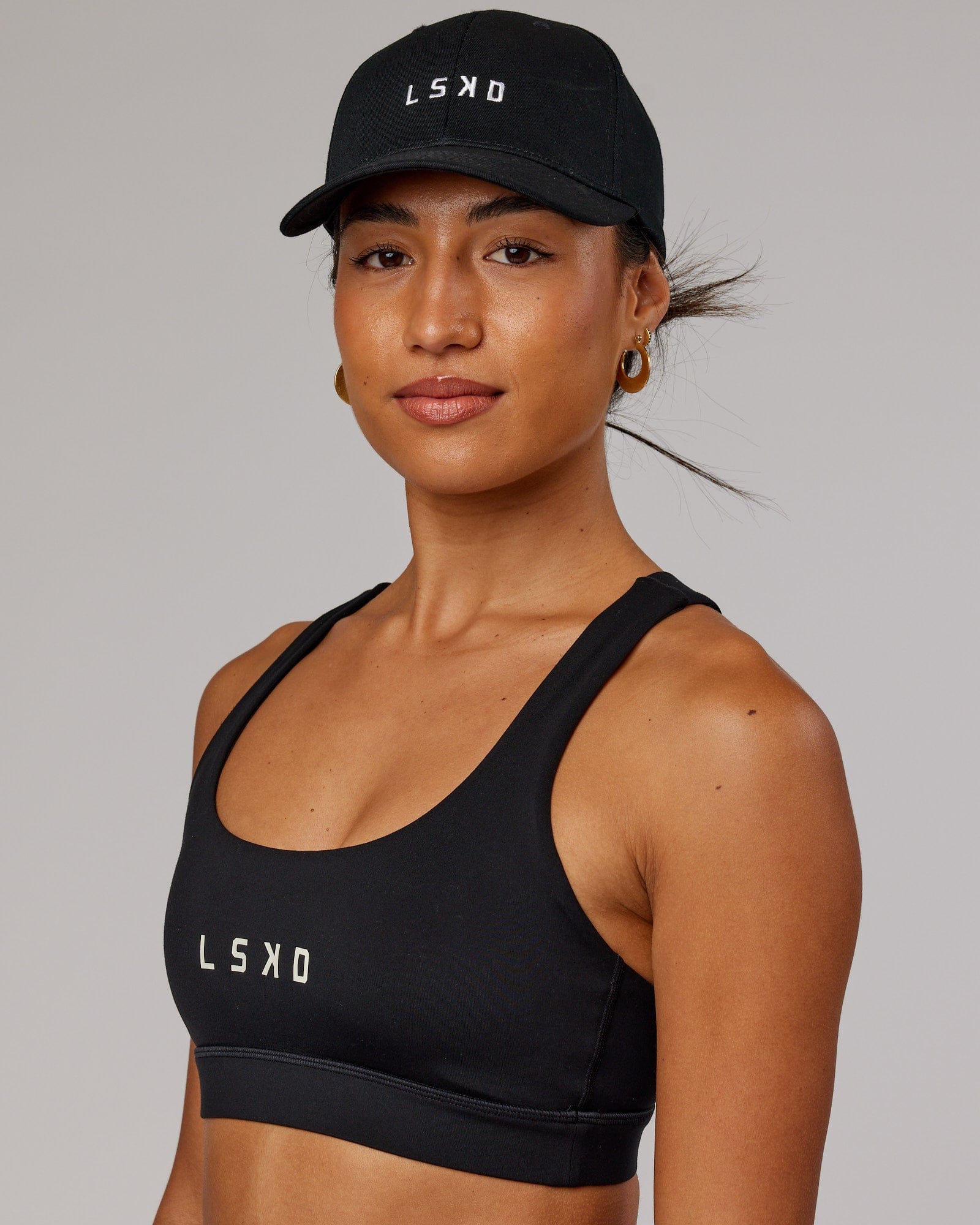 Model wearing Classic Strapback Cap - Black