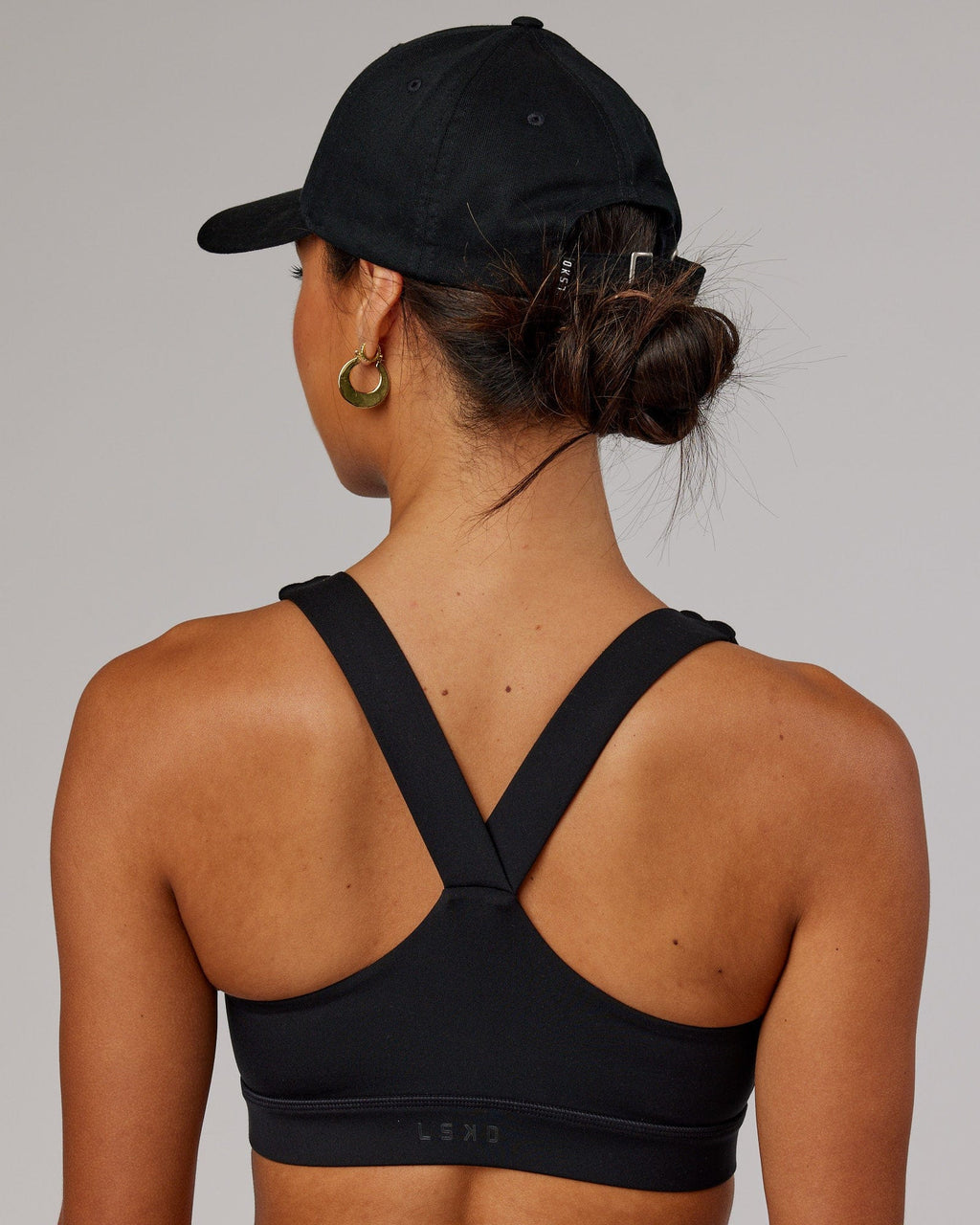 Model wearing Classic Strapback Cap - Black