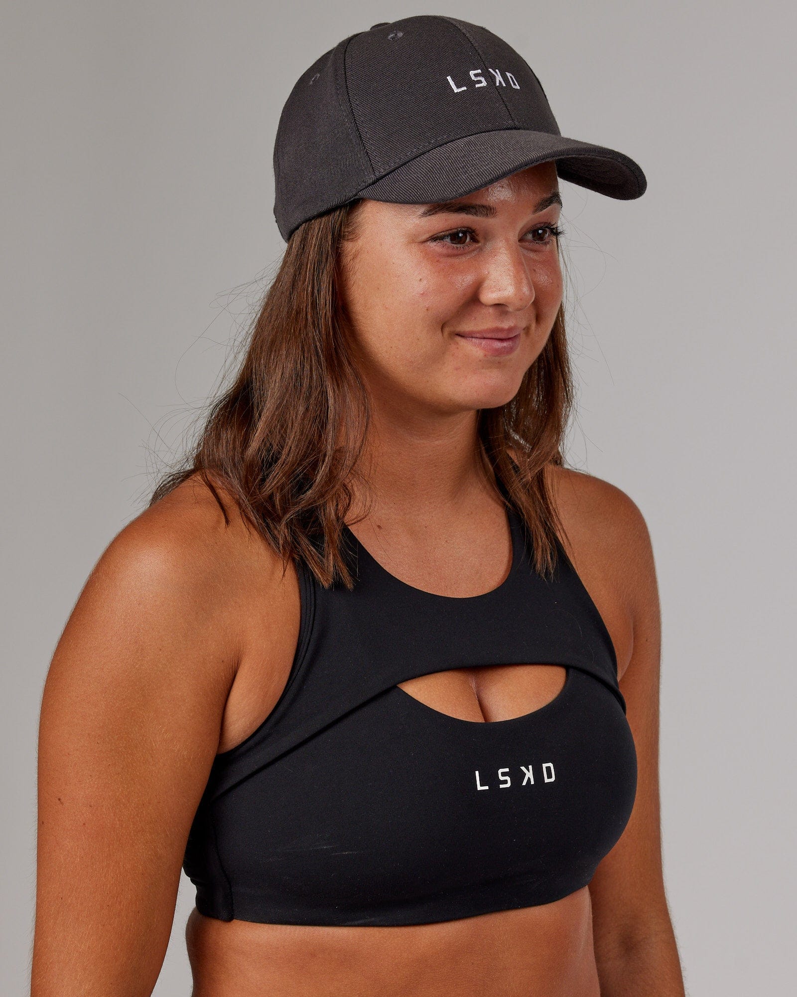 Model wearing Classic Strapback Cap - Asphalt