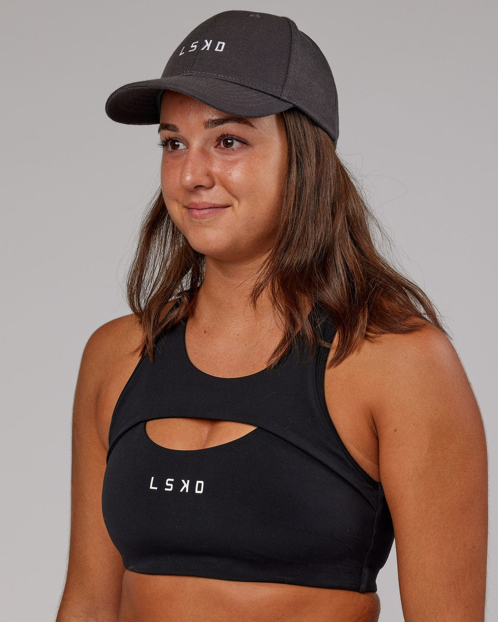 Model wearing Classic Strapback Cap - Asphalt