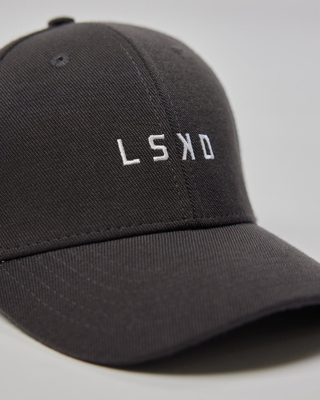 Model wearing Classic Strapback Cap - Asphalt