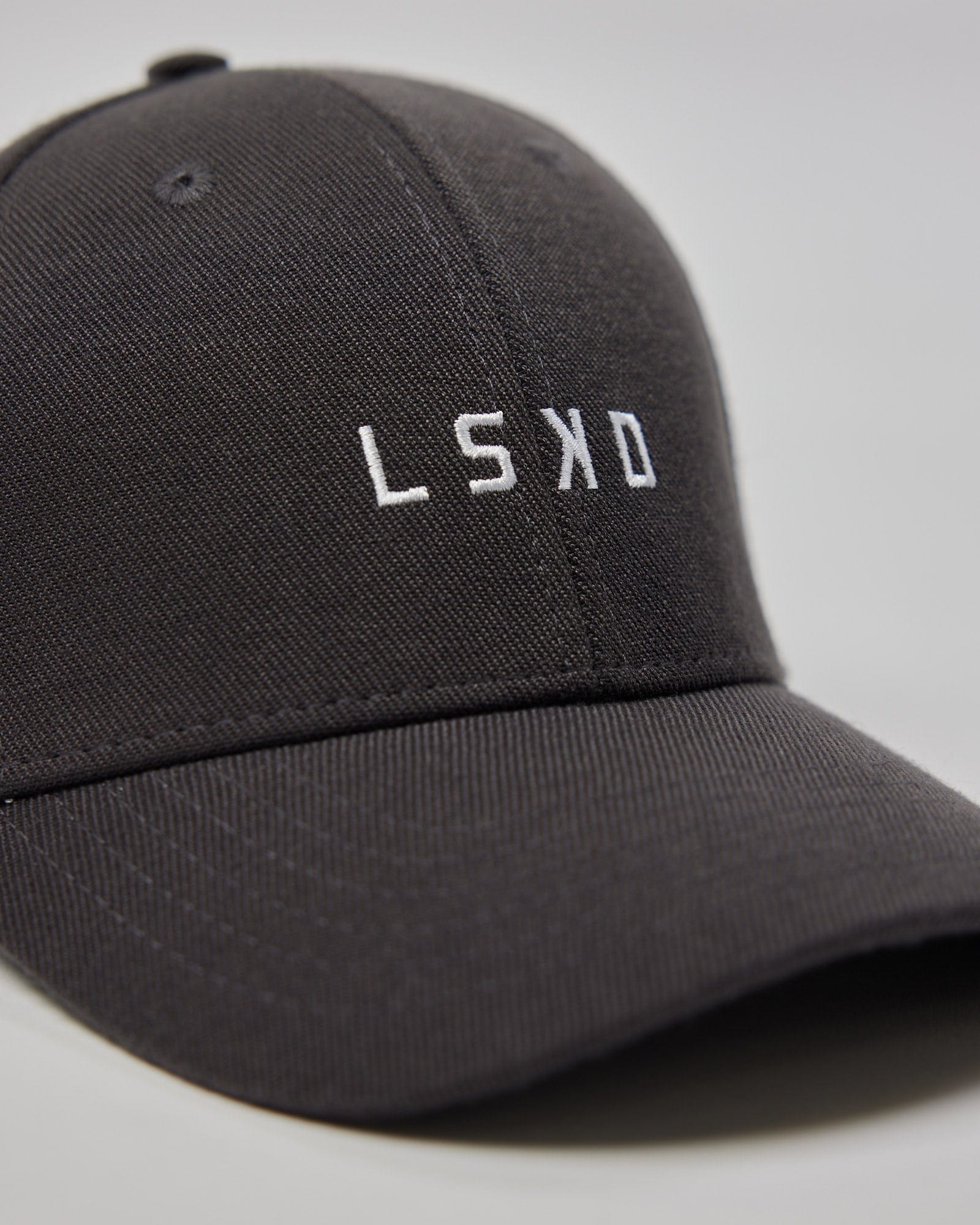 Model wearing Classic Strapback Cap - Asphalt