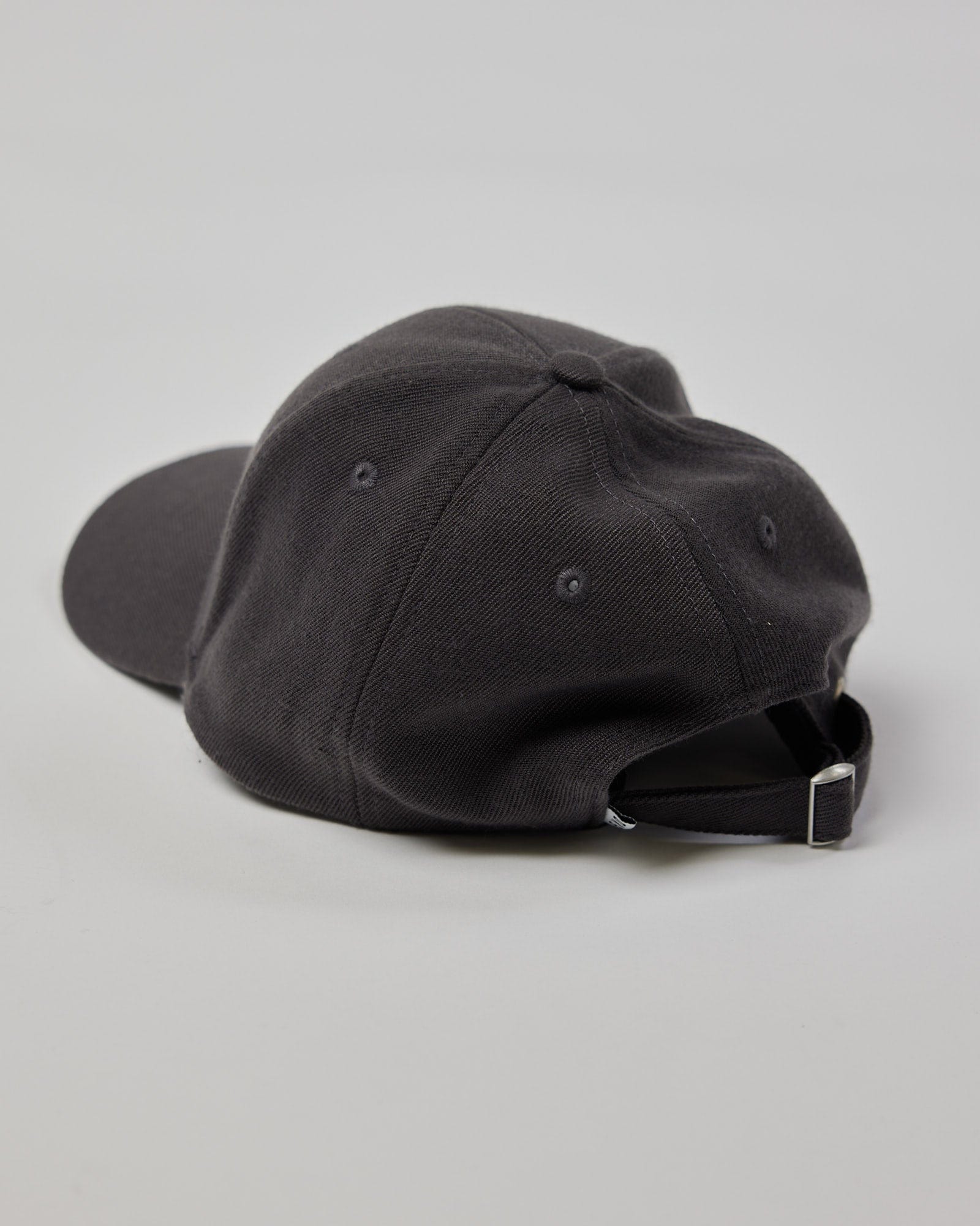 Model wearing Classic Strapback Cap - Asphalt