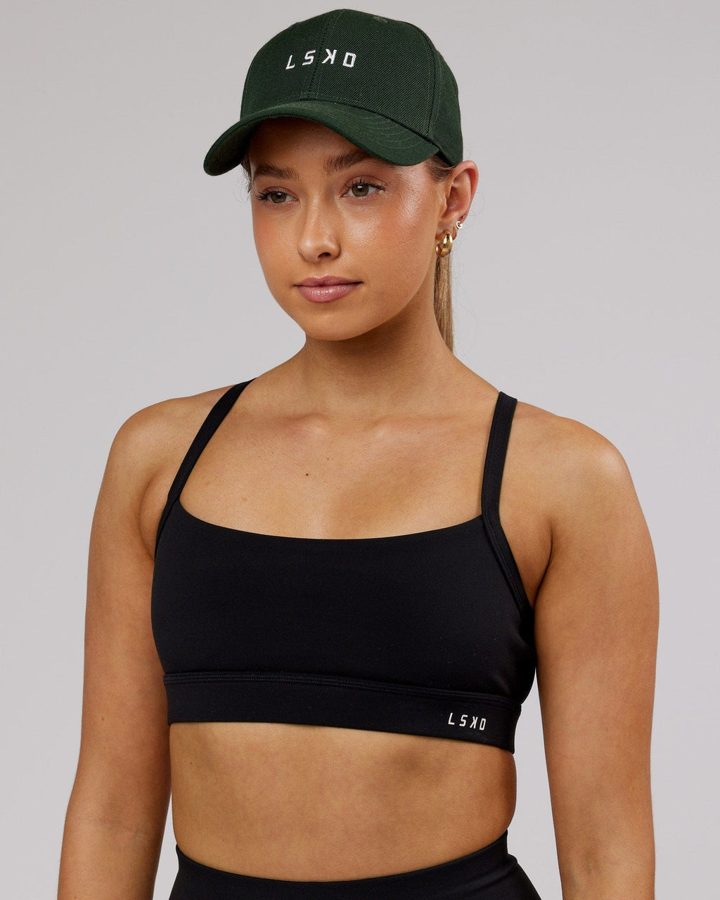 Model wearing Classic Strapback Cap - Pineneedle
