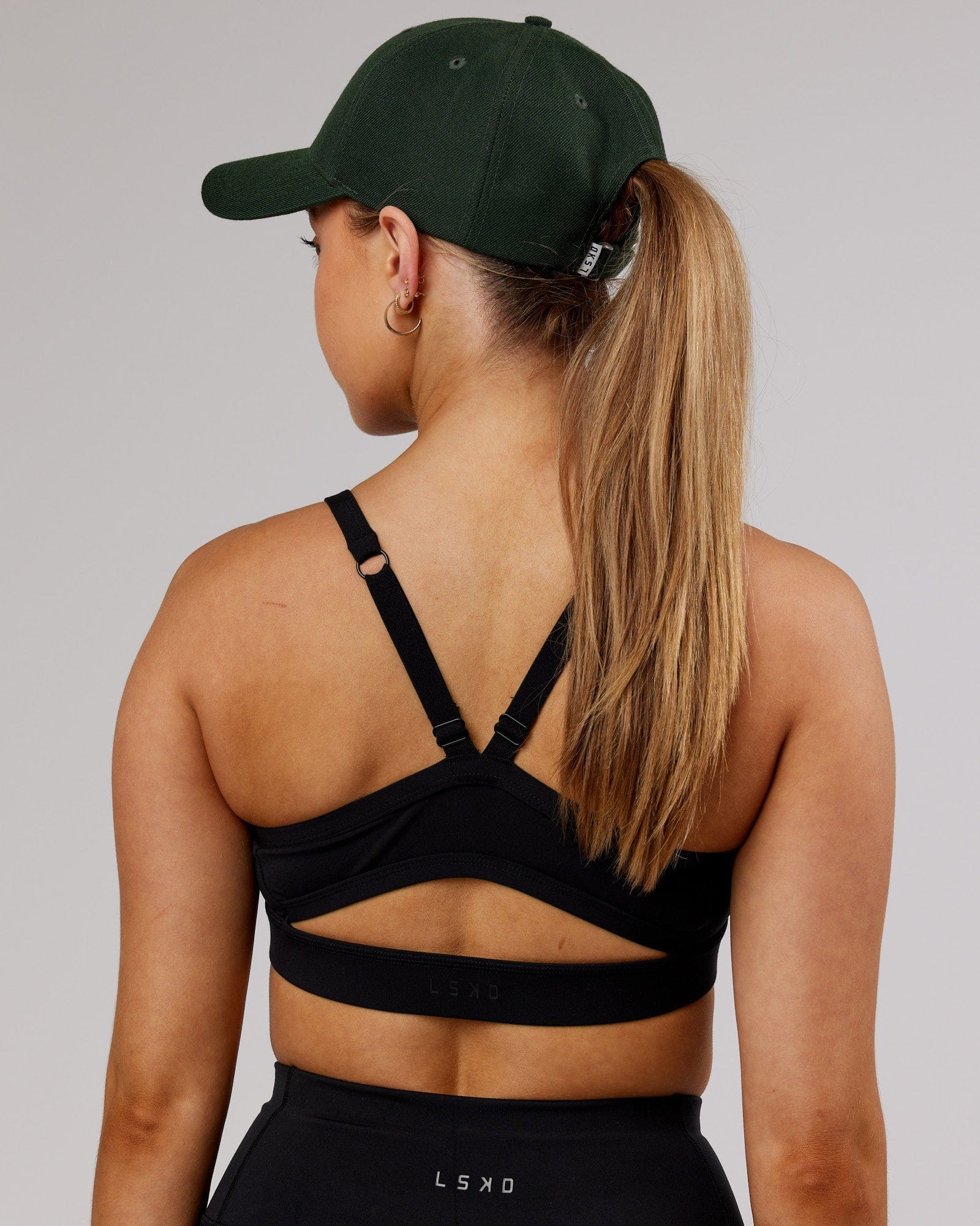 Model wearing Classic Strapback Cap - Pineneedle