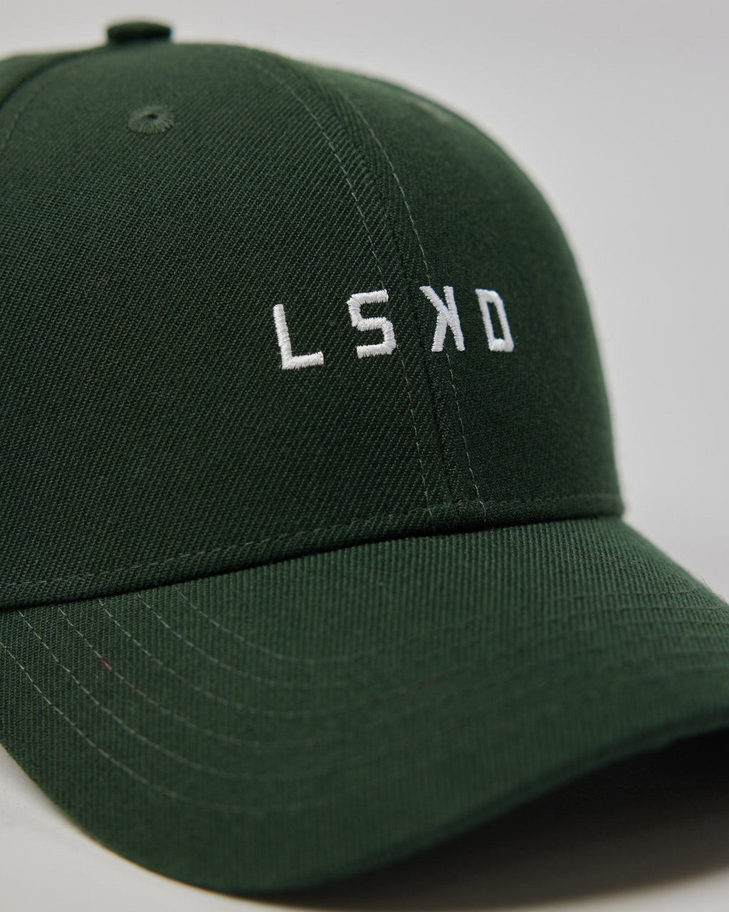 Model wearing Classic Strapback Cap - Pineneedle