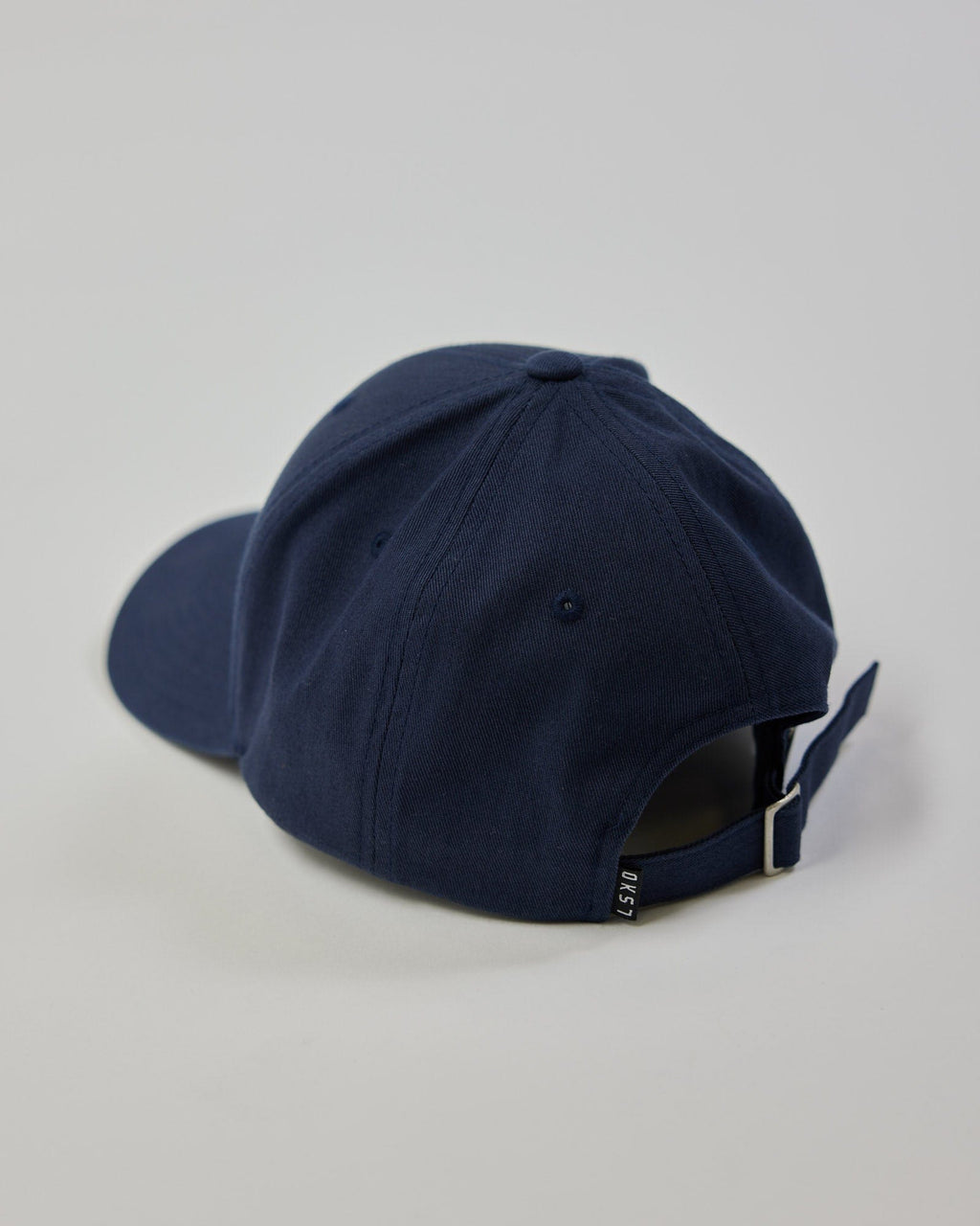 Model wearing Classic Strapback Cap - Navy