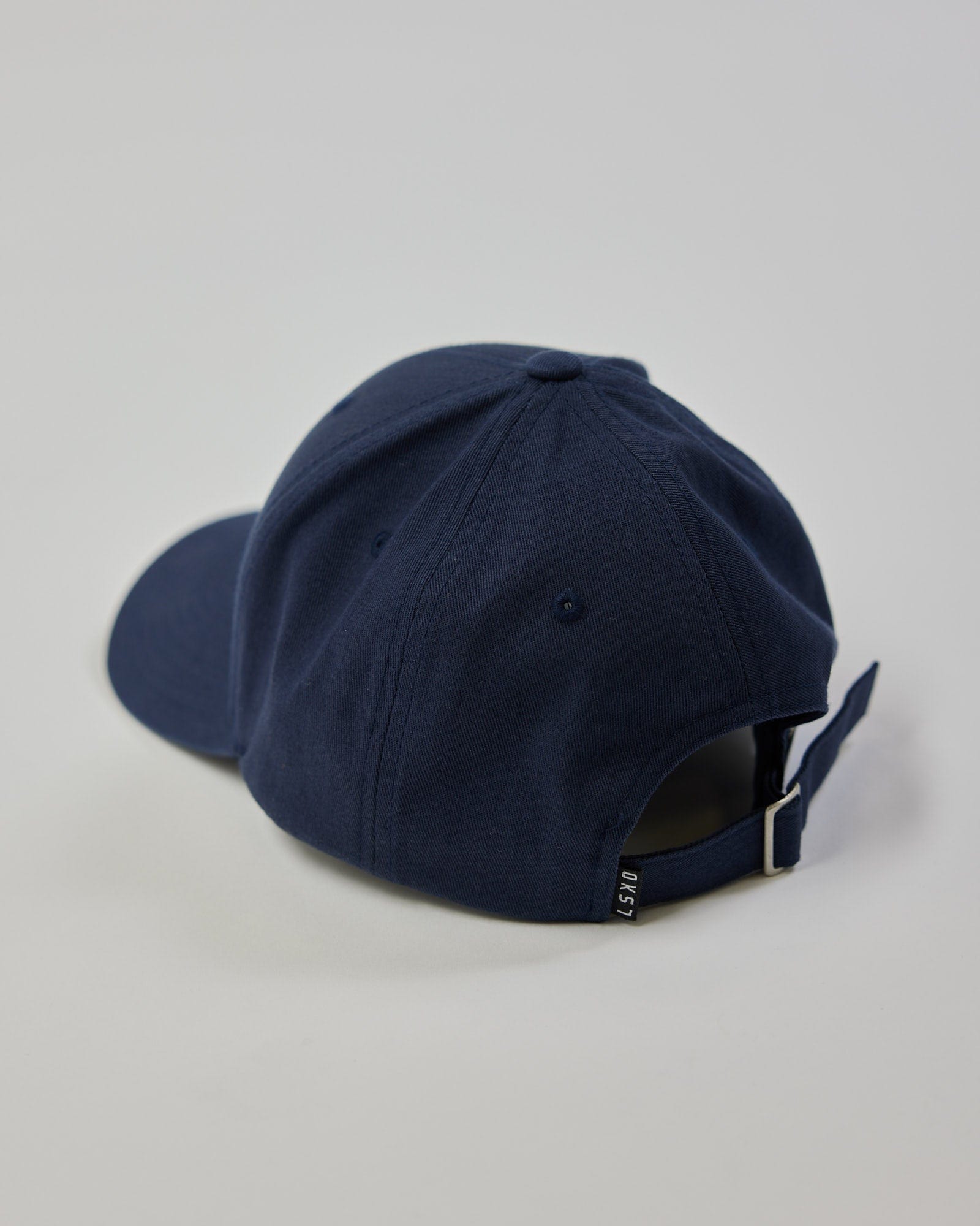 Model wearing Classic Strapback Cap - Navy
