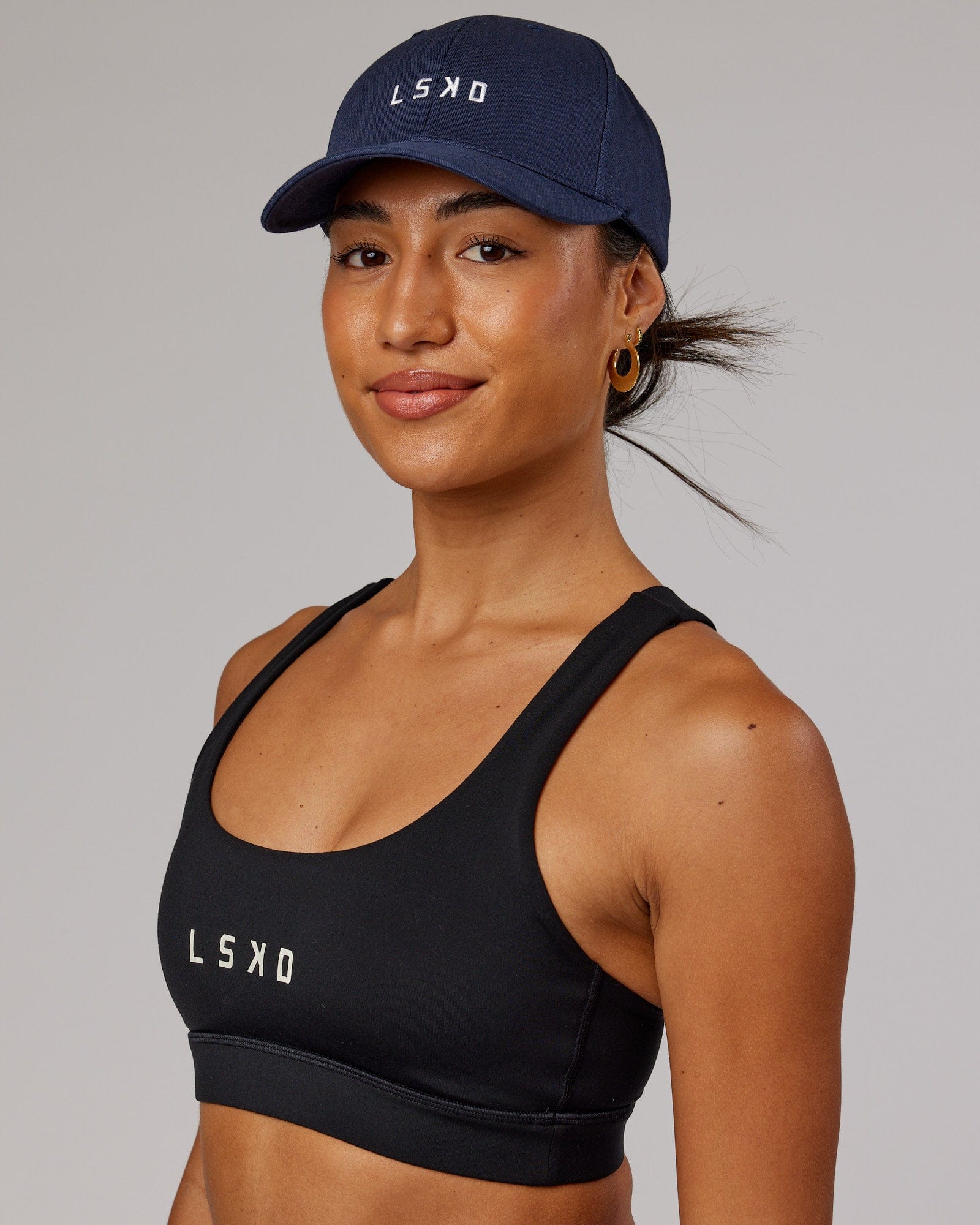 Model wearing Classic Strapback Cap - Navy