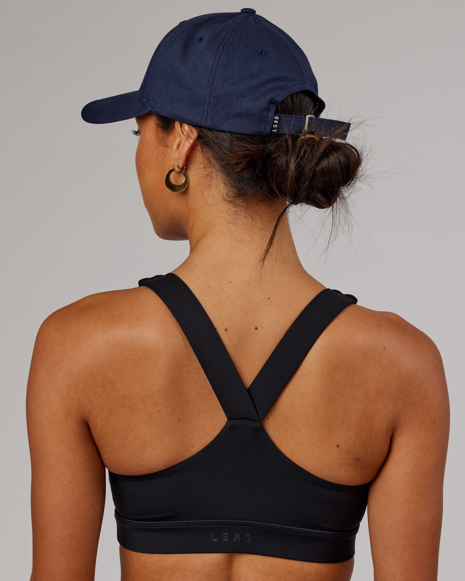 Model wearing Classic Strapback Cap - Navy