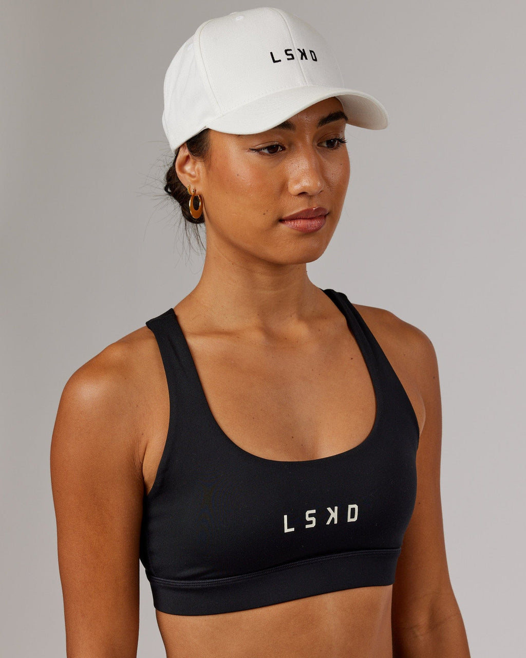 Model wearing Classic Strapback Cap - White