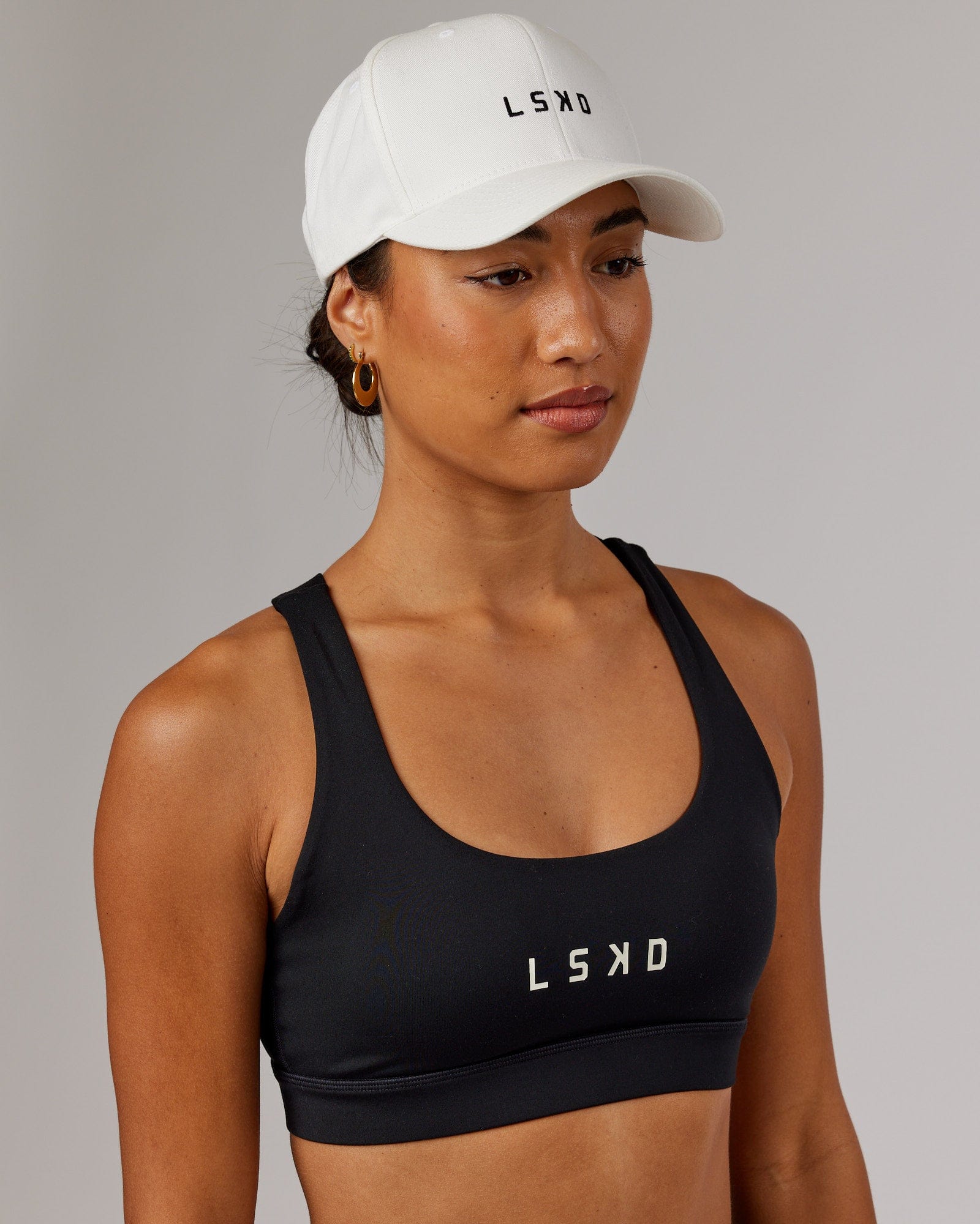 Model wearing Classic Strapback Cap - White