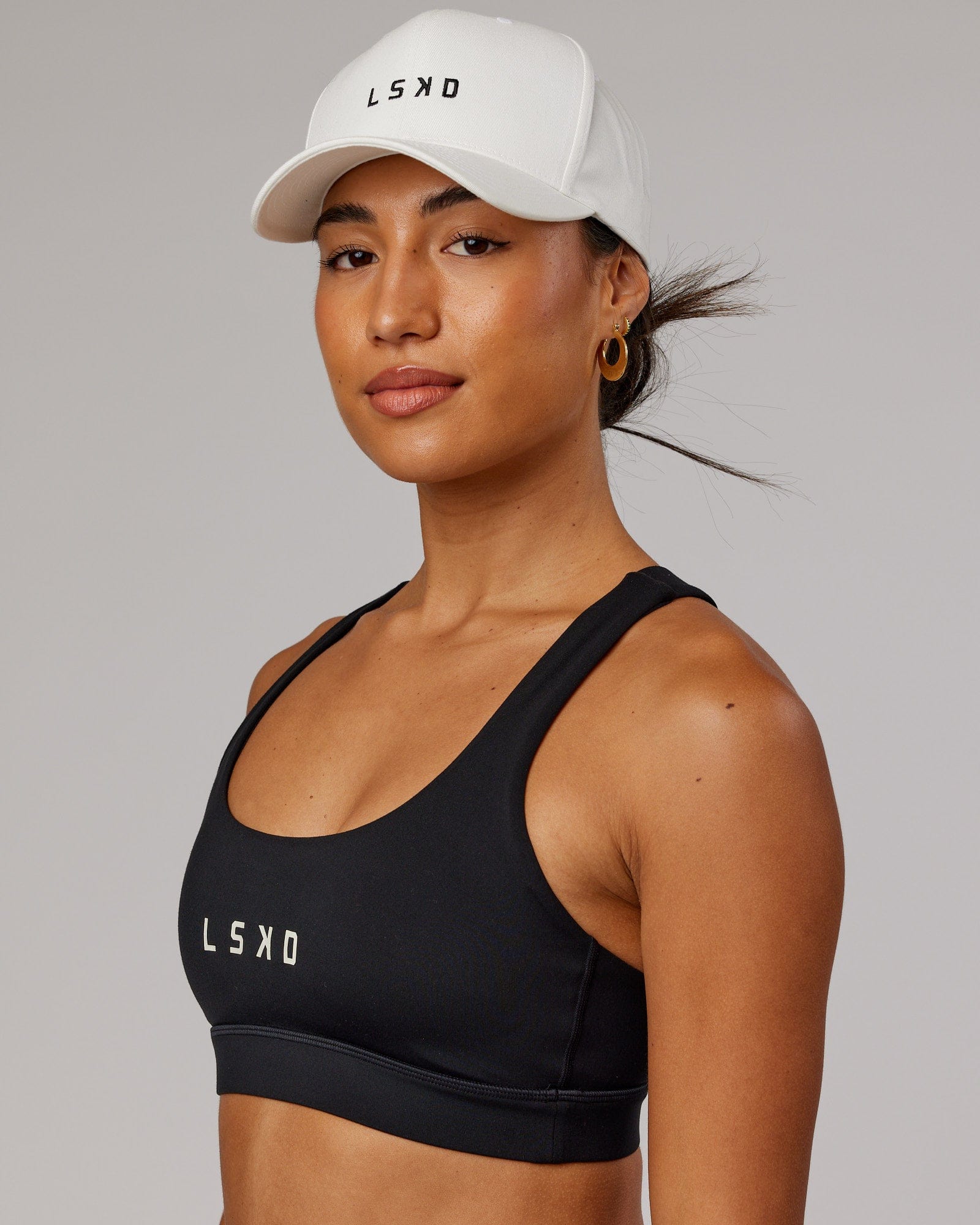 Model wearing Classic Strapback Cap - White