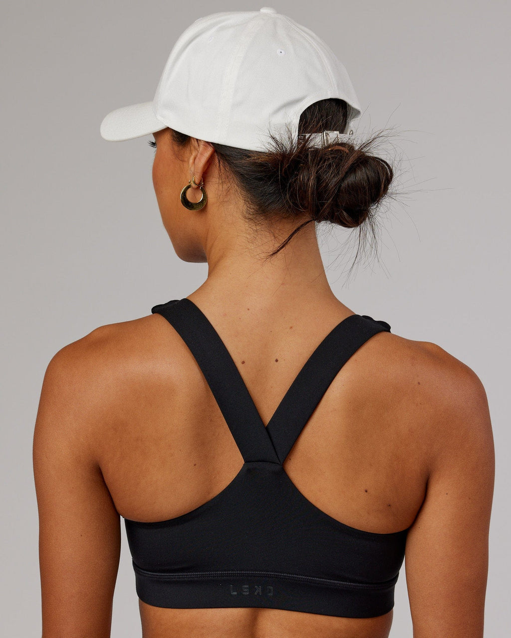 Model wearing Classic Strapback Cap - White