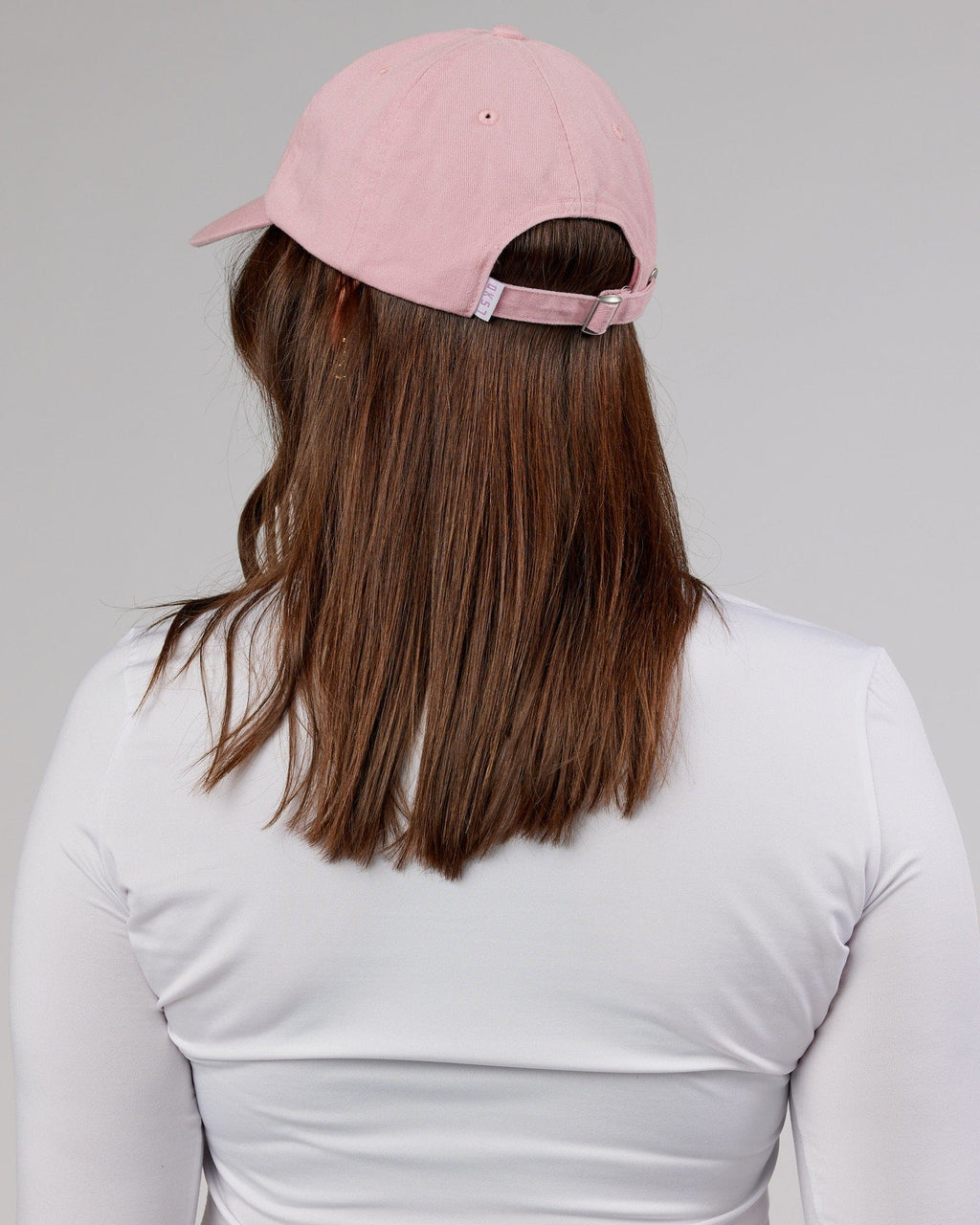 Model wearing Compact Cap - Bleached Mauve