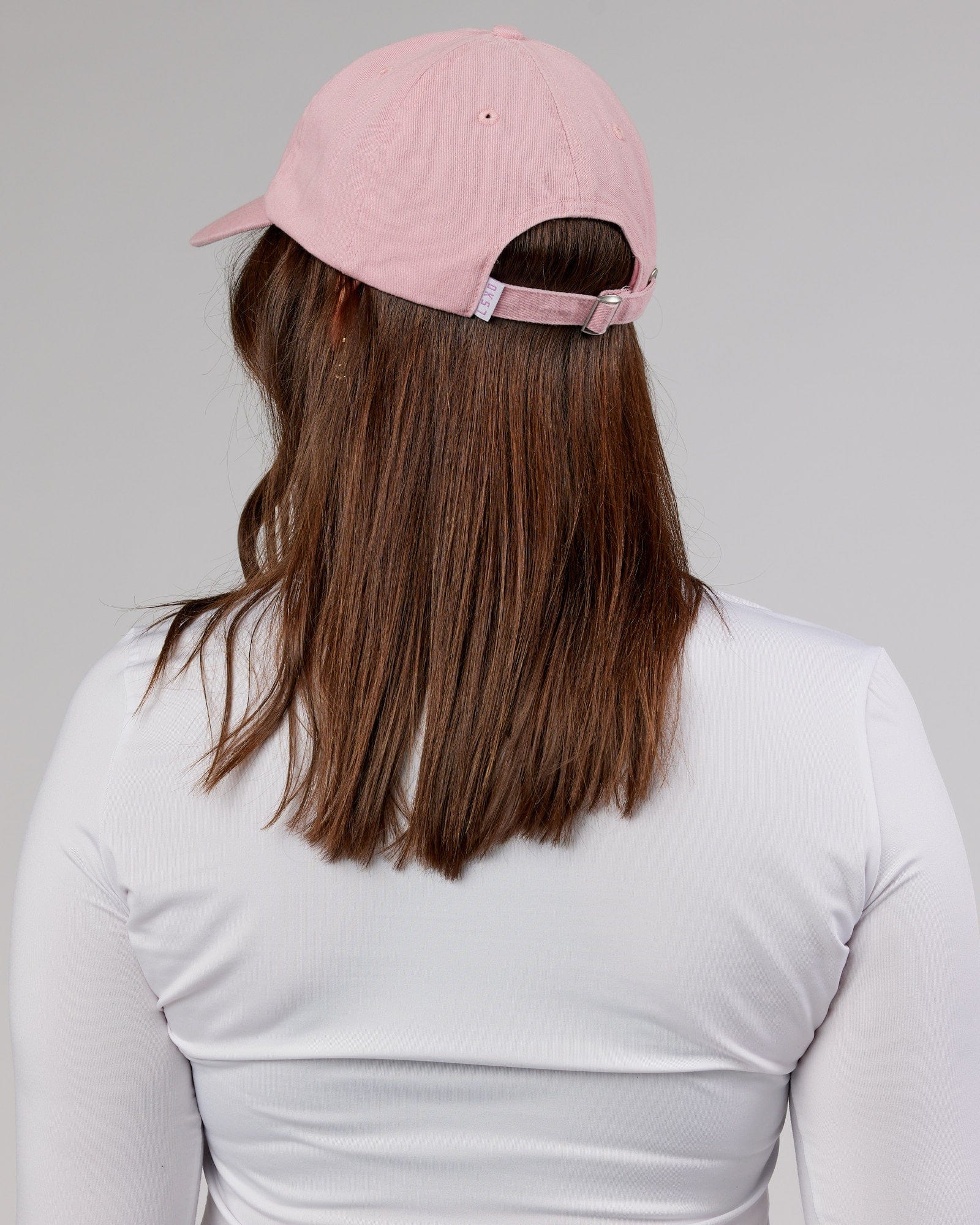Model wearing Compact Cap - Bleached Mauve