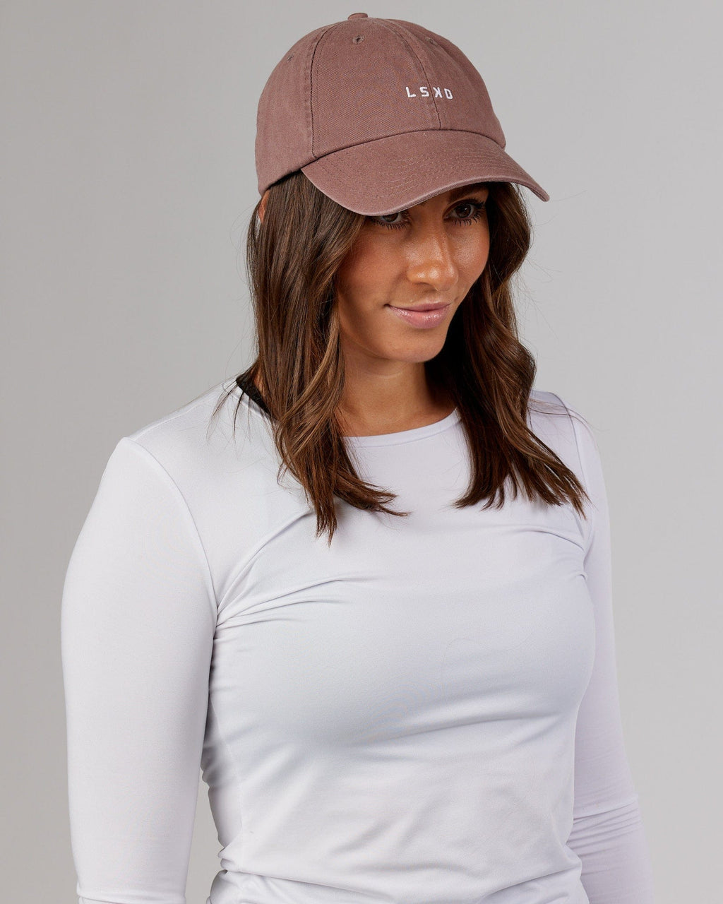 Model wearing Compact Cap - Deep Taupe