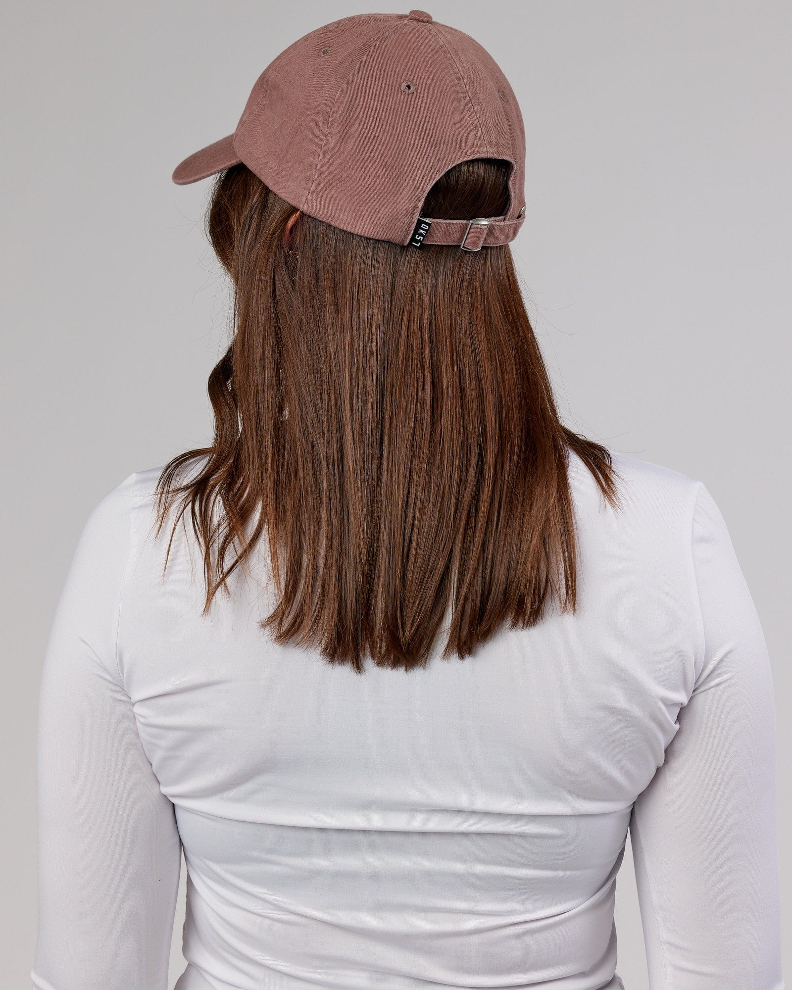 Model wearing Compact Cap - Deep Taupe