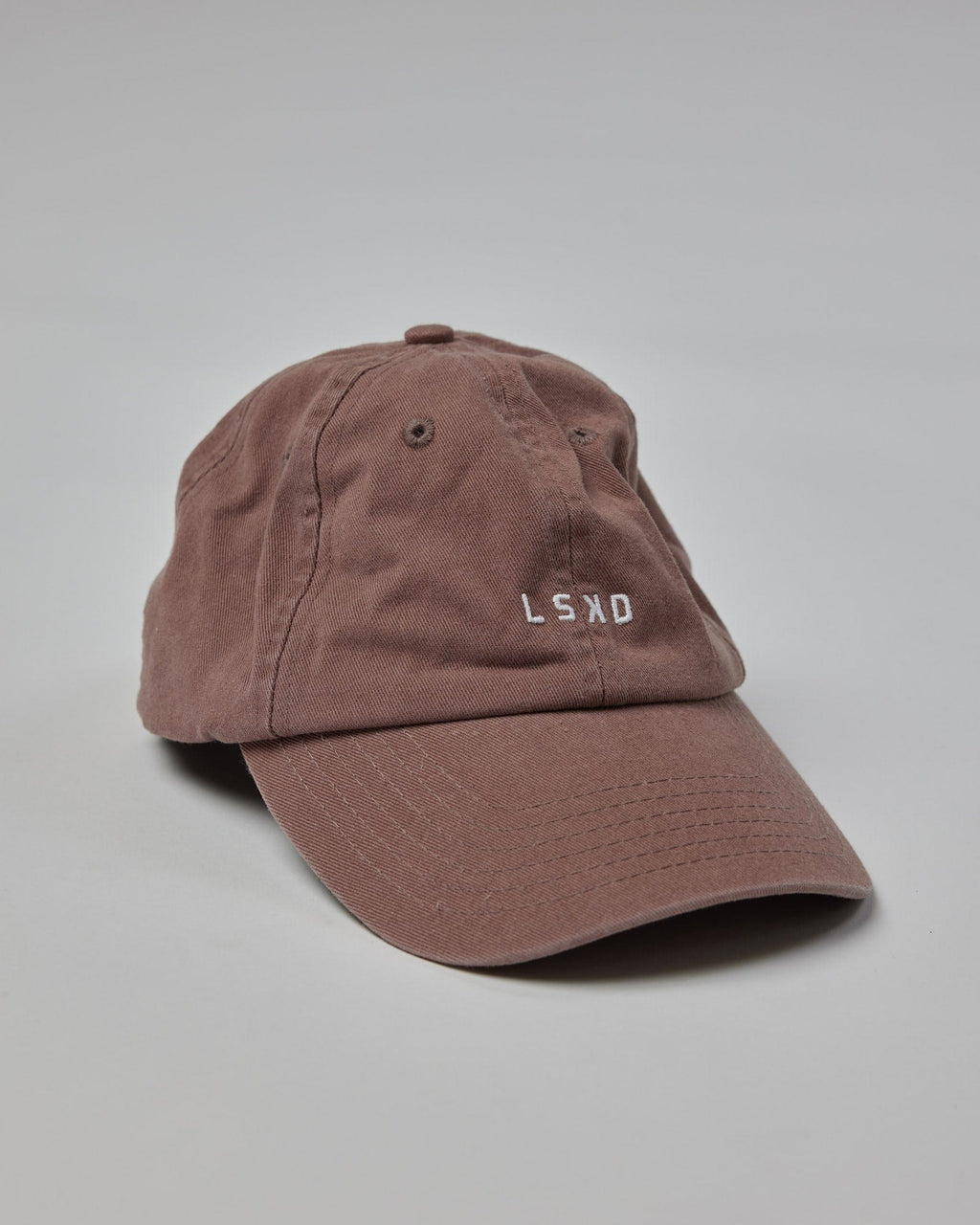 Model wearing Compact Cap - Deep Taupe