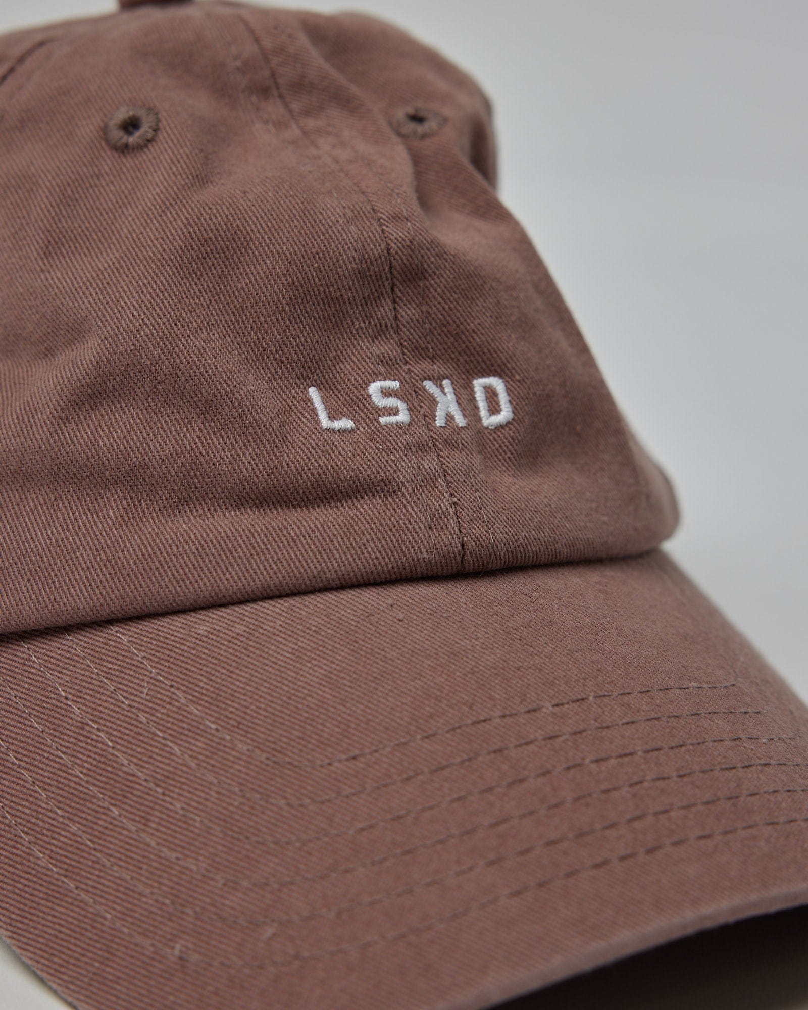 Model wearing Compact Cap - Deep Taupe