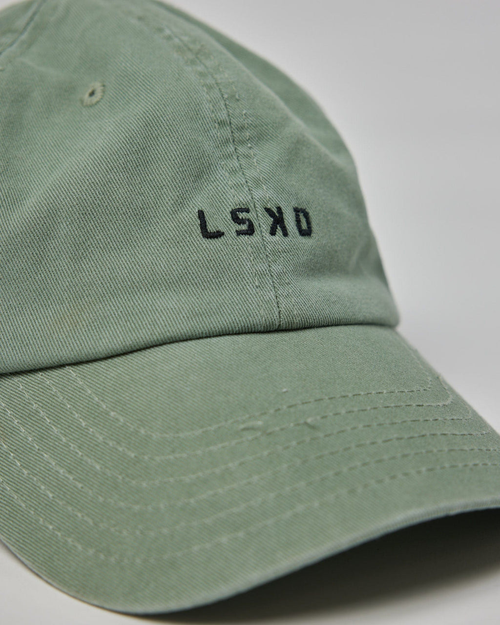 Model wearing Compact Cap - Desert Sage