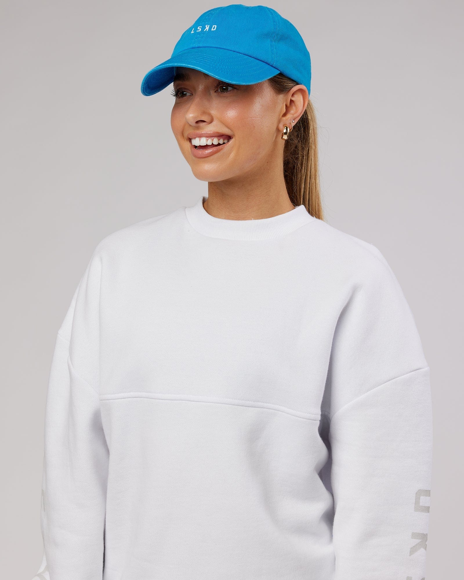 Model wearing Compact Cap - Washed Ibiza Blue