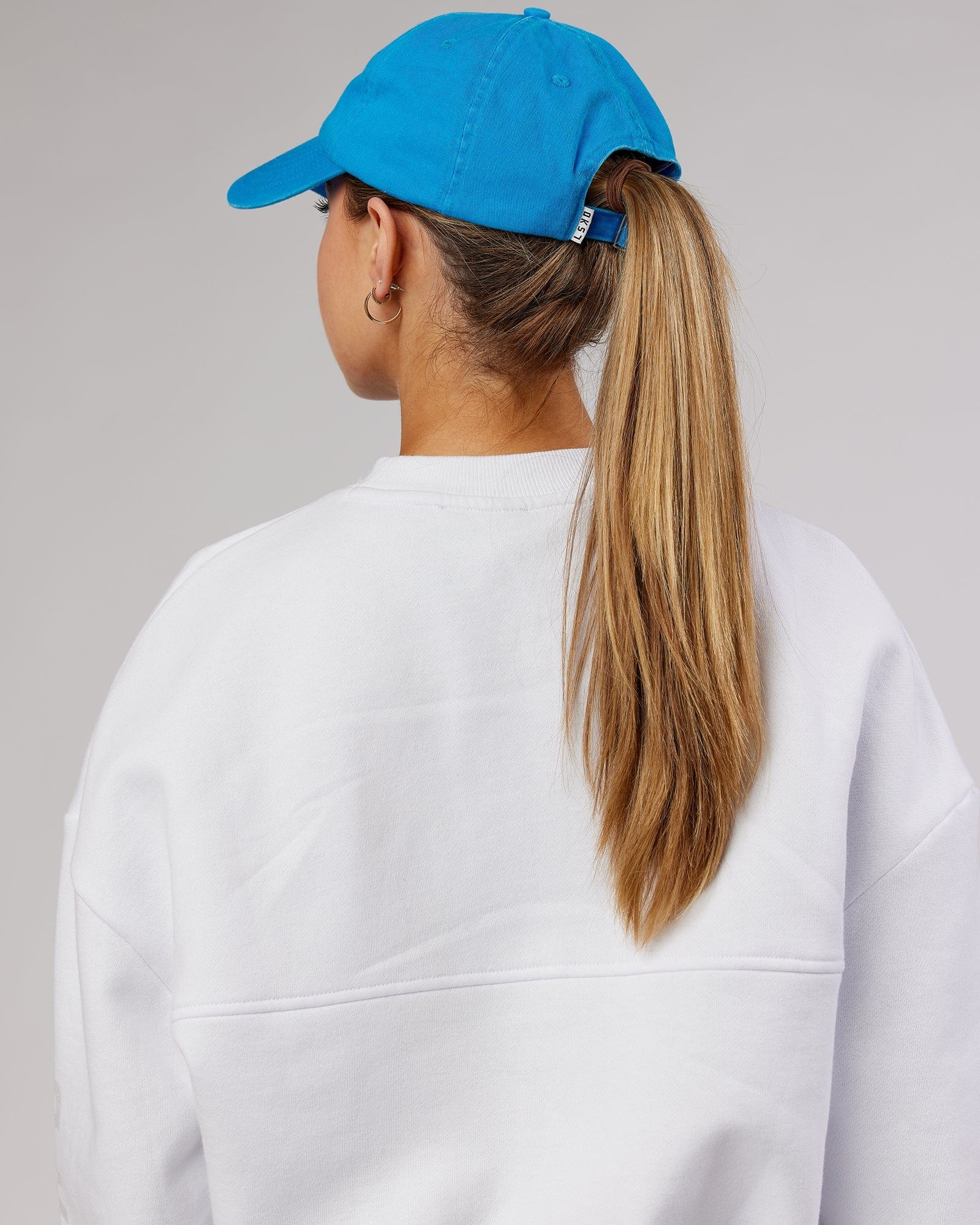 Model wearing Compact Cap - Washed Ibiza Blue