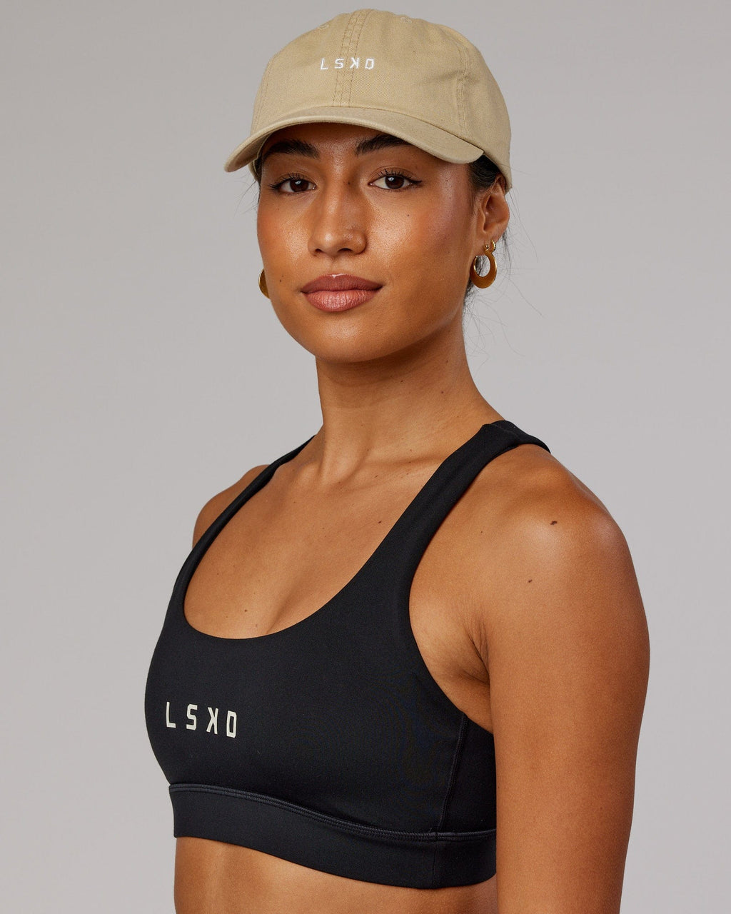 Model wearing Compact Cap - Pale Khaki