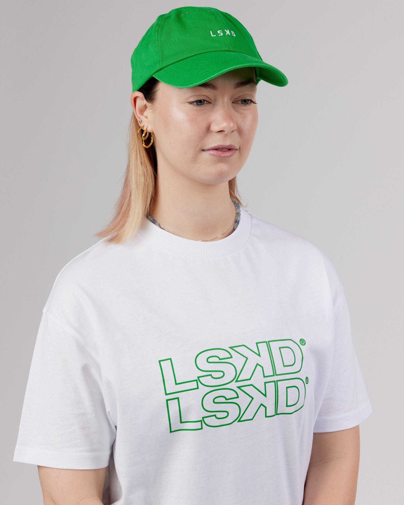 Model wearing Compact Cap - Washed Vivid Green