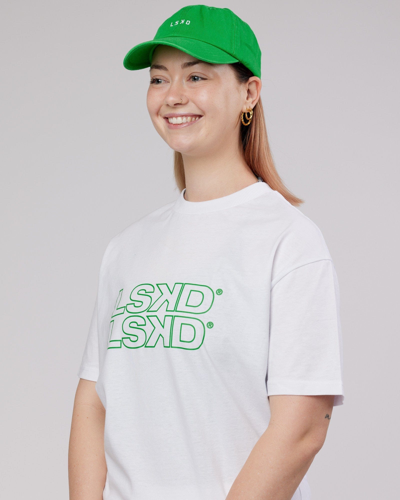 Model wearing Compact Cap - Washed Vivid Green