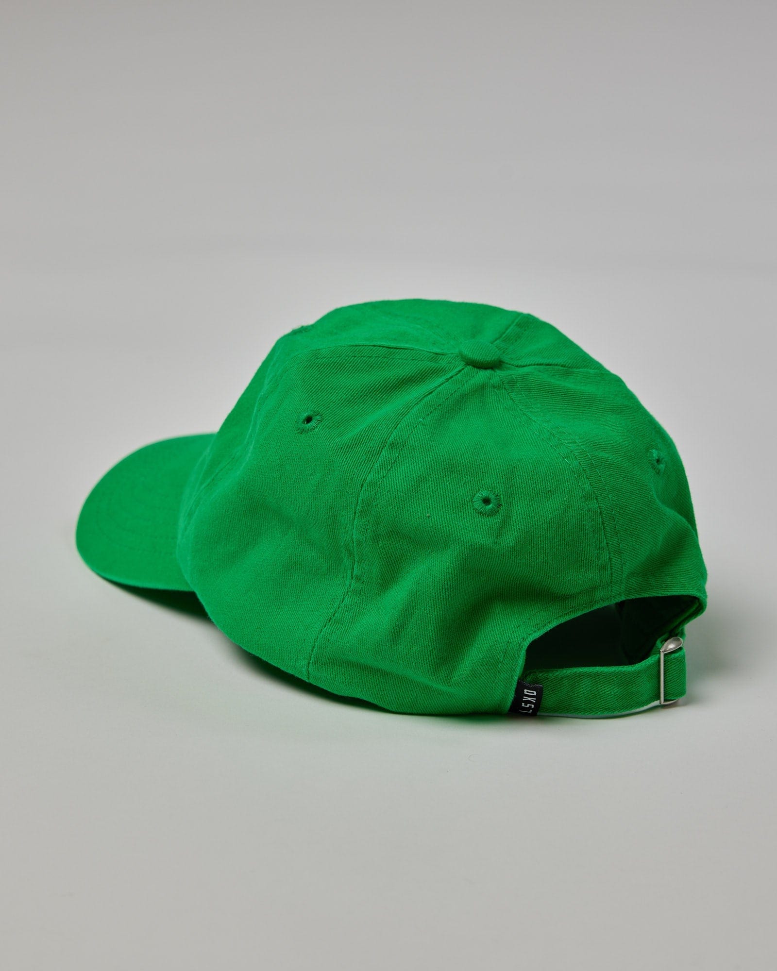 Model wearing Compact Cap - Washed Vivid Green