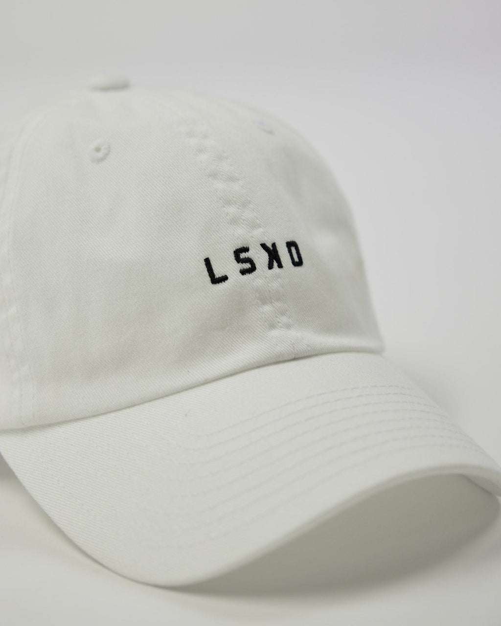 Model wearing Compact Cap - White