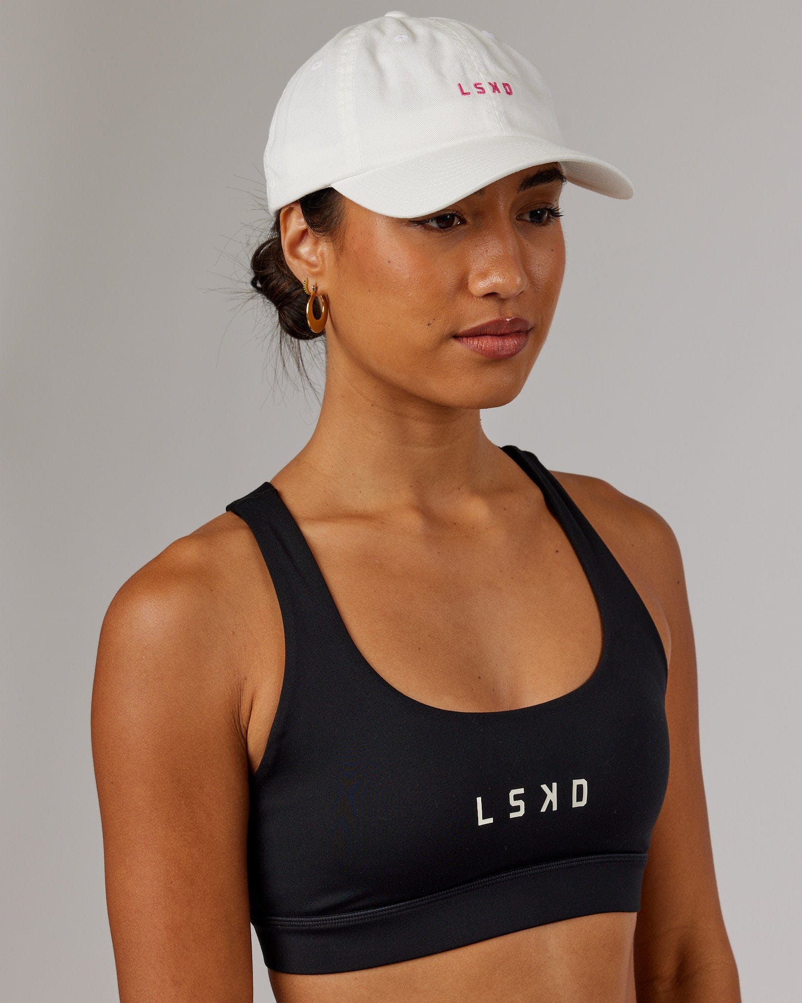 Model wearing Compact Cap - White-Flamingo