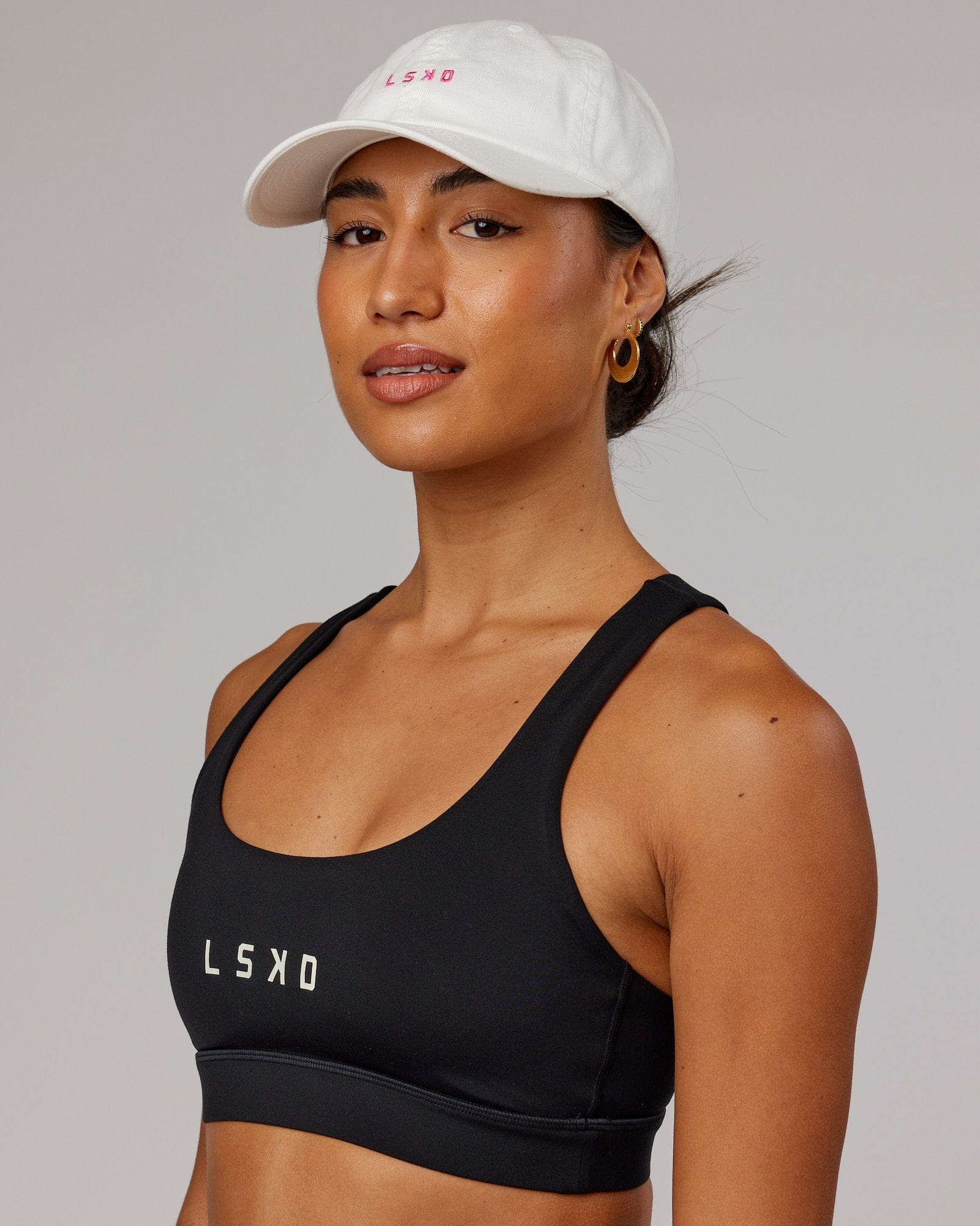 Model wearing Compact Cap - White-Flamingo