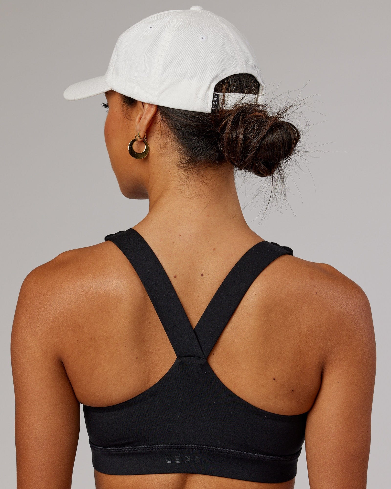 Model wearing Compact Cap - White-Flamingo