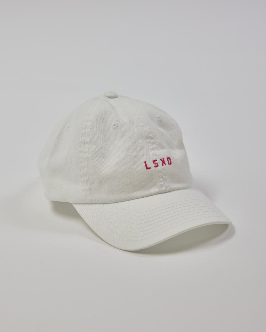 Model wearing Compact Cap - White-Flamingo