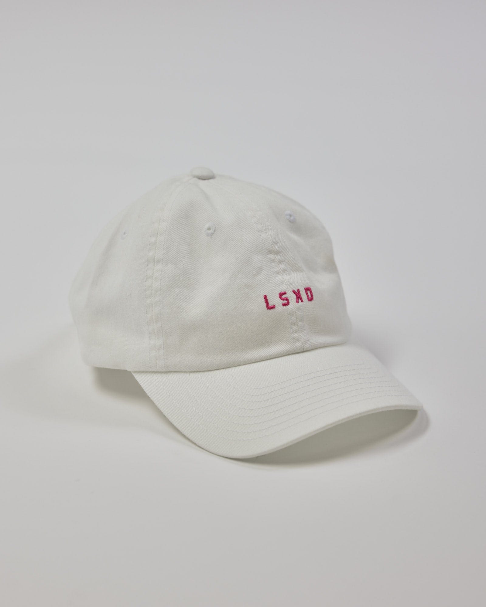 Model wearing Compact Cap - White-Flamingo