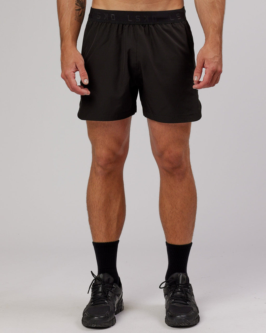 Model wearing Competition 5" Performance Short - Black