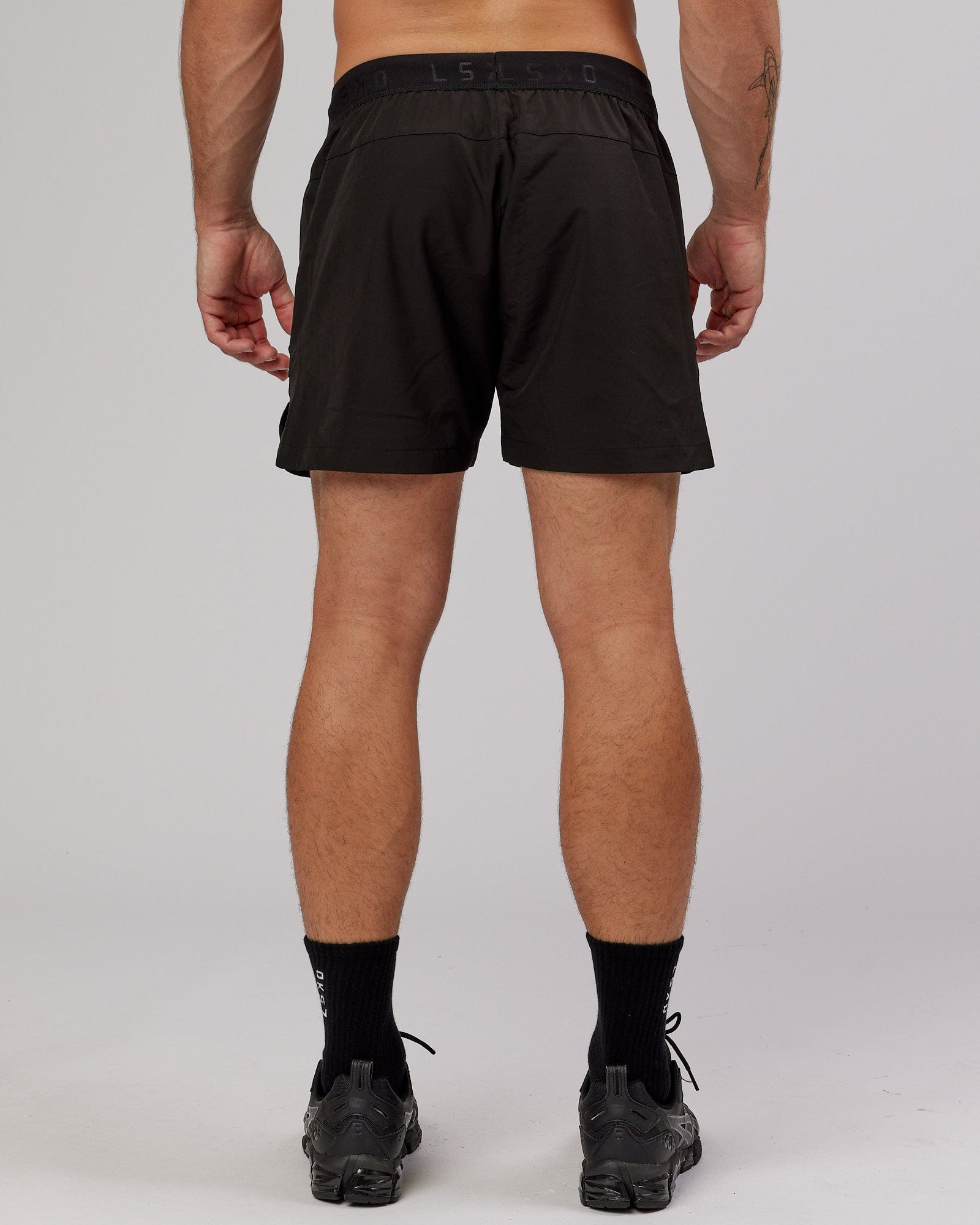Model wearing Competition 5" Performance Short - Black