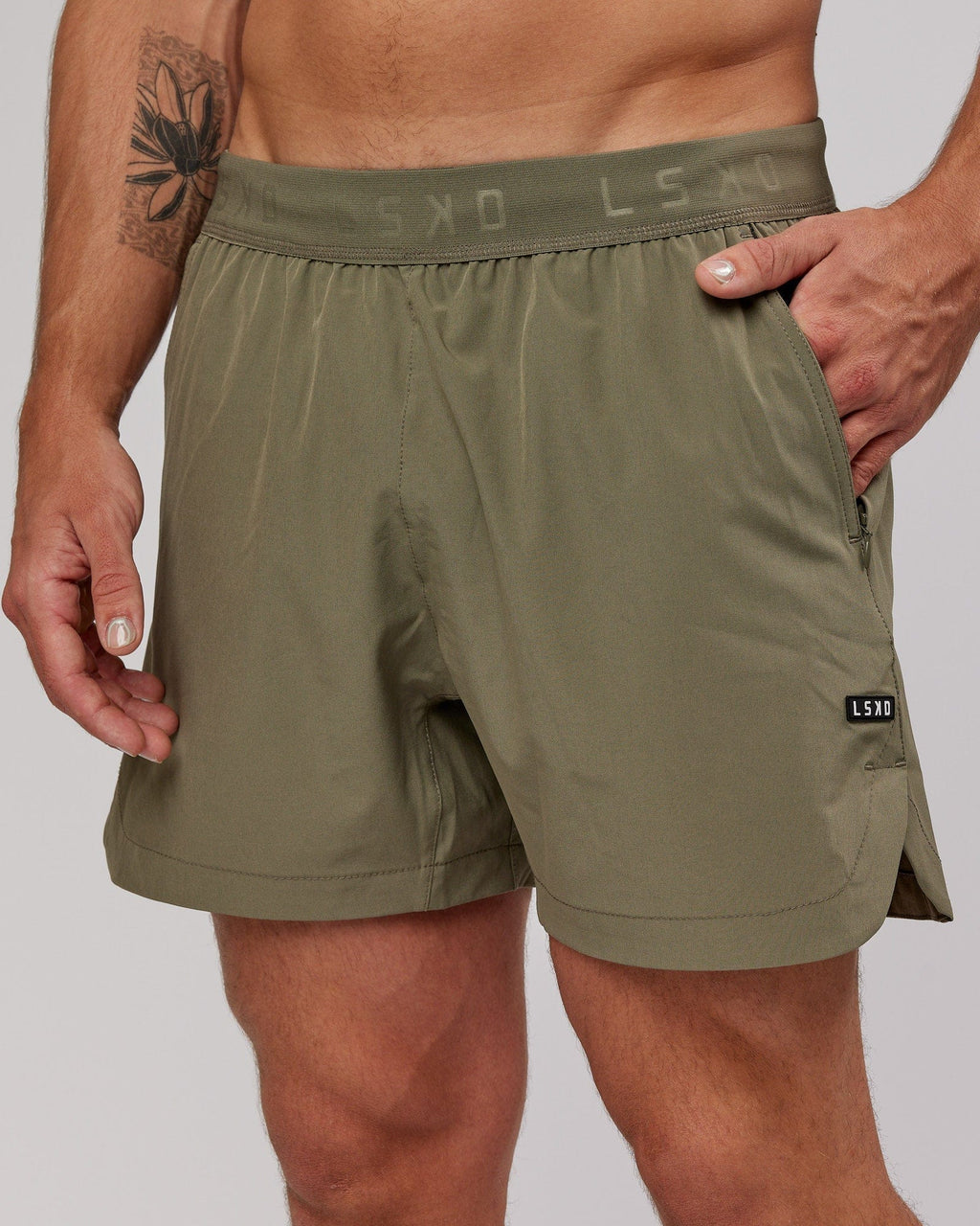 Model wearing Competition 5" Performance Short - Olive Fade